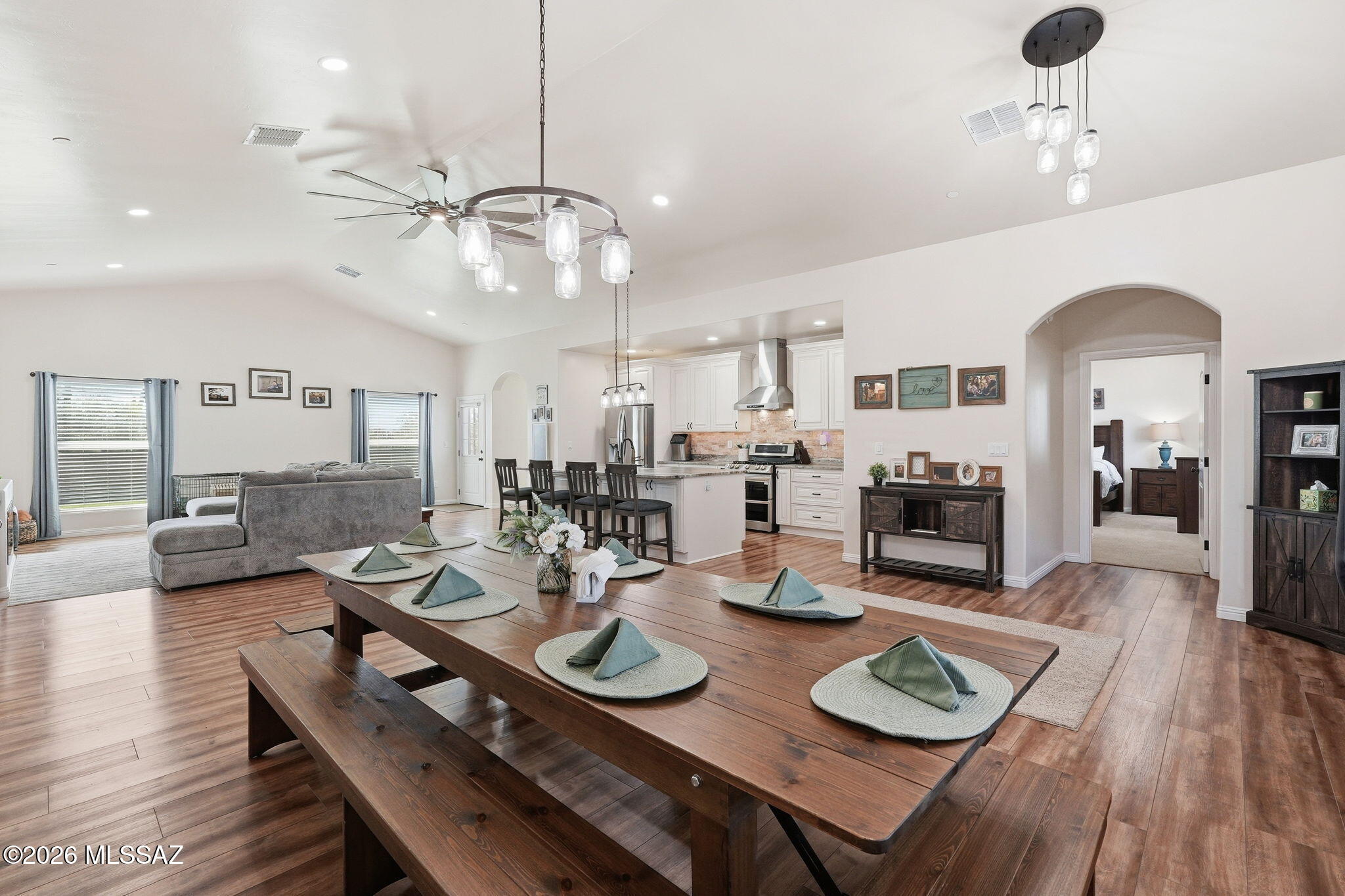 Experience barndominion-style living on 3.17 acres with stunning views of Sombrero Peak. This thoughtfully designed home features matching stone countertops throughout, a split-bedroom floor plan, spacious guest rooms, a luxury, jetted, soaking tub, and a floor-to-ceiling tiled walk-in shower. The large butler pantry and built-in office add everyday convenience. A versatile bonus room with a private entrance and half bath is perfect for guests quarters, a studio, or a home business. Outside, enjoy a fenced backyard with stone blocks and white picket fencing, horse zoning, and an oversized garage with space for vehicles, quads, motorcycles, and more. Complete with a metal roof, spray foam insulation, premium systems and a sleek linear electric fireplace this is the one.