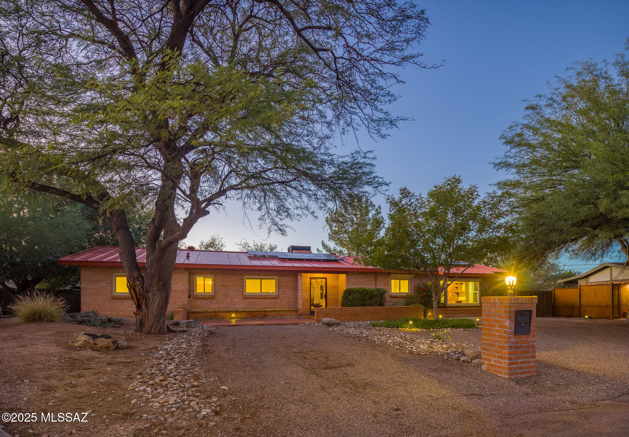 This Beautiful Classic brick home is located on a quite Cul-De-Sac in the highly desirable Poets Corner. It features 4 bedrooms 2 primaries, 3 bathrooms, & an inviting open floor plan designed for modern living. The spacious family room flows seamlessly into a gourmet kitchen complete with granite countertops, a movable island, a full-height pantry cabinet, and stainless-steel appliances. Inviting Fireplace and real hardwood floors in living and dining room. The main primary bathroom includes dual vanities and a walk-in shower. Second primary and the 2 additional bedrooms provide flexible space for the family. Stained concrete floors in all bedrooms. Large laundry room. updated dual pane windows, newer metal roof, HVAC and OWNED solar. Huge backyard, one of the largest in the neighborhood