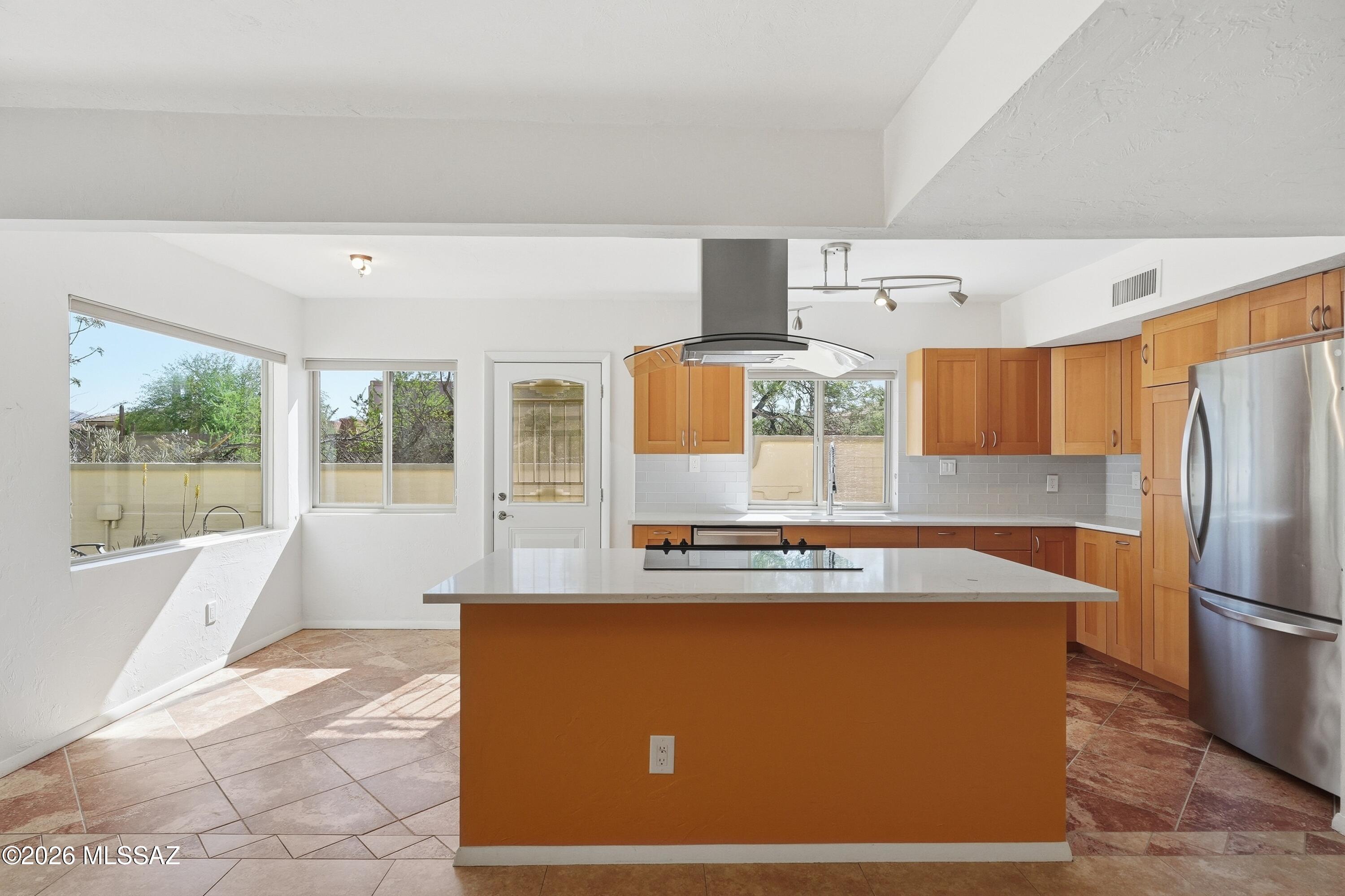 Stylish, spacious, and framed by stunning mountain views - this beautifully updated townhome is a true gem! This 2-bed, 2-bath home features an open and versatile floor plan with a formal living room, formal dining area, and a welcoming family room. The kitchen showcases custom cabinetry, quartz countertops, and a center island. Two generously sized bedrooms offer comfort and privacy. Step outside to an extended patio where you can relax and take in the serene surroundings. Enjoy added lifestyle perks with a community pool and nearby walking paths. This move-in-ready home offers the perfect combination of comfort, views, and community - don't miss your chance to make it yours!