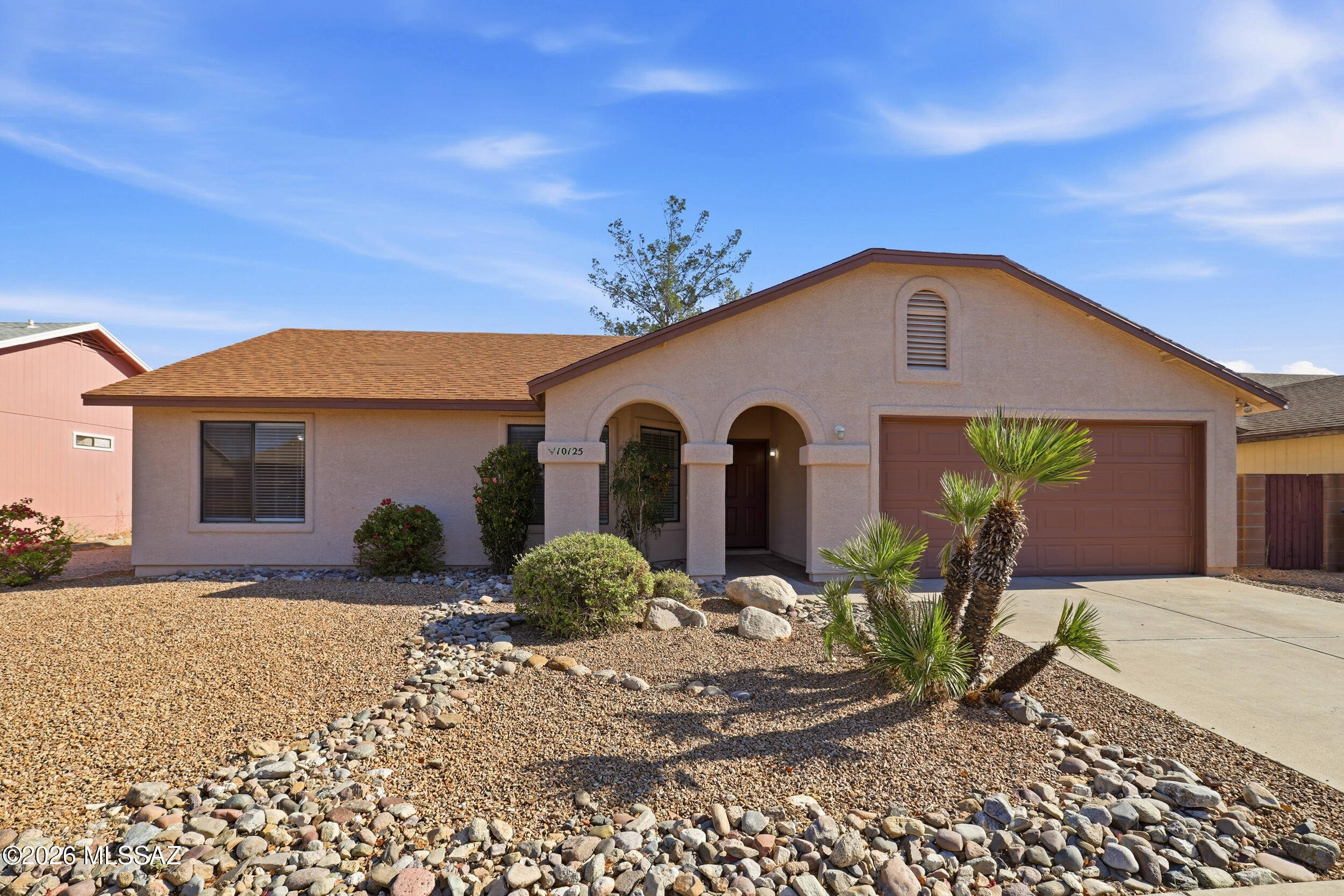Immaculate 3BD/2BA East Tucson home featuring over 1,300 sq. ft. of comfortable living space with vaulted ceilings, tile flooring throughout, and a cozy fireplace. Spacious backyard offers a covered patio, pond feature, and powered storage/workshop shed. Newer appliances and HVAC system provide added value and peace of mind. Full plumbing has been replaced in recent years NO POLLY PIPES. Conveniently located near shopping, dining, parks, and schools, this move-in-ready property combines comfort, functionality, and low-maintenance living.