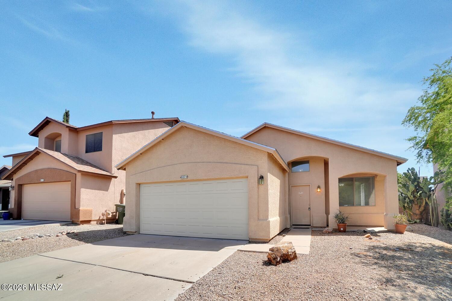 Southeast location,3 Bd/2 Bath, 2 car garage home. Bright, airy Living room, High Ceilings, Eat in Kitchen with electric range. Master bdrm with large closets, AC, W/D hook up in utility room, Tiled floors throughout. Large fenced backyard, with no back neighbors. Vail Schools, Convenient shopping