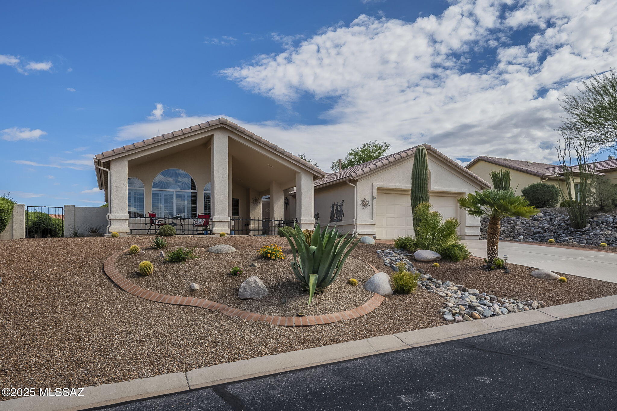 Experience resort style living in highly sought after Saddlebrooke Golf Community. Meticulously maintained 2Bed 2ba+bonus room, w/welcoming covered front porch & extended flagstone patio to  enjoy AZ outdoor living & mountain views. Popular split plan  provides privacy along w/ versatile options for room design & use. A grand entry sets the tone, opening to a spacious living area w/vaulted ceiling & walls of windows that flow seamlessly to the rear yard entertainment area. The kitchen is the hub of the home featuring abundant cabinetry, sleek new stainless steel appliances, a convenient built-in desk & ample counter space adjoining casual dining area & bonus room, ideal for family gatherings or game night. Spacious primary suite hosts a new luxurious bath retreat featuring a custom tile walk- or wheel-in shower w/ wide entry and seating. Two walk-in closets, executive-height dual sink vanity, granite countertops & new lighting adding designer appeal.
Ultimate privacy on both sides of this home. Guests have access to a full bath, while the primary suite is secluded on the opposite side of the home. Ideal for out of town visitors or family.
Inviting front & rear yards feature blooming desert landscaping, designed for beauty & easy maintenance year-round. Thousands of dollars in 4" wood blinds throughout home add style & increase energy efficiency. Community residents revel in resort-style amenities including golf, swimming pools, fitness centers, tennis, pickleball, restaurants, restaurants & bars, social clubs, exercise trails, and countless activities for an active lifestyle. Don't miss your chance to enjoy everything this elite community and home have to offer!