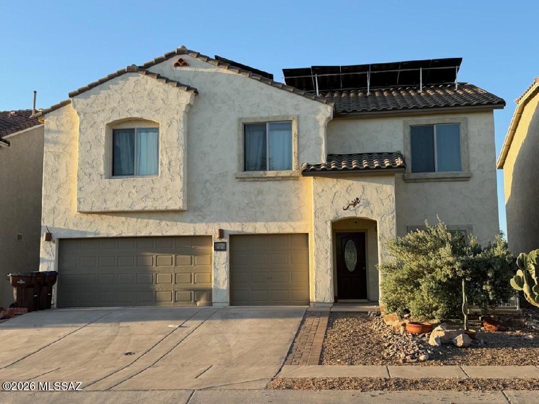 Beautiful spacious home with views and open desert in the back. Surround sound in great room, huge upper loft and 2nd floor laundry to die for! Great kitchen with 2 pantries and tons of storage space. 3 car garage features work bench and shelving, 14. 5 kilowatt Solar Panels on property to help keep cost way down during the hot summer months and through out the year, Beautifully appointed back yard. This is a Must See Property.