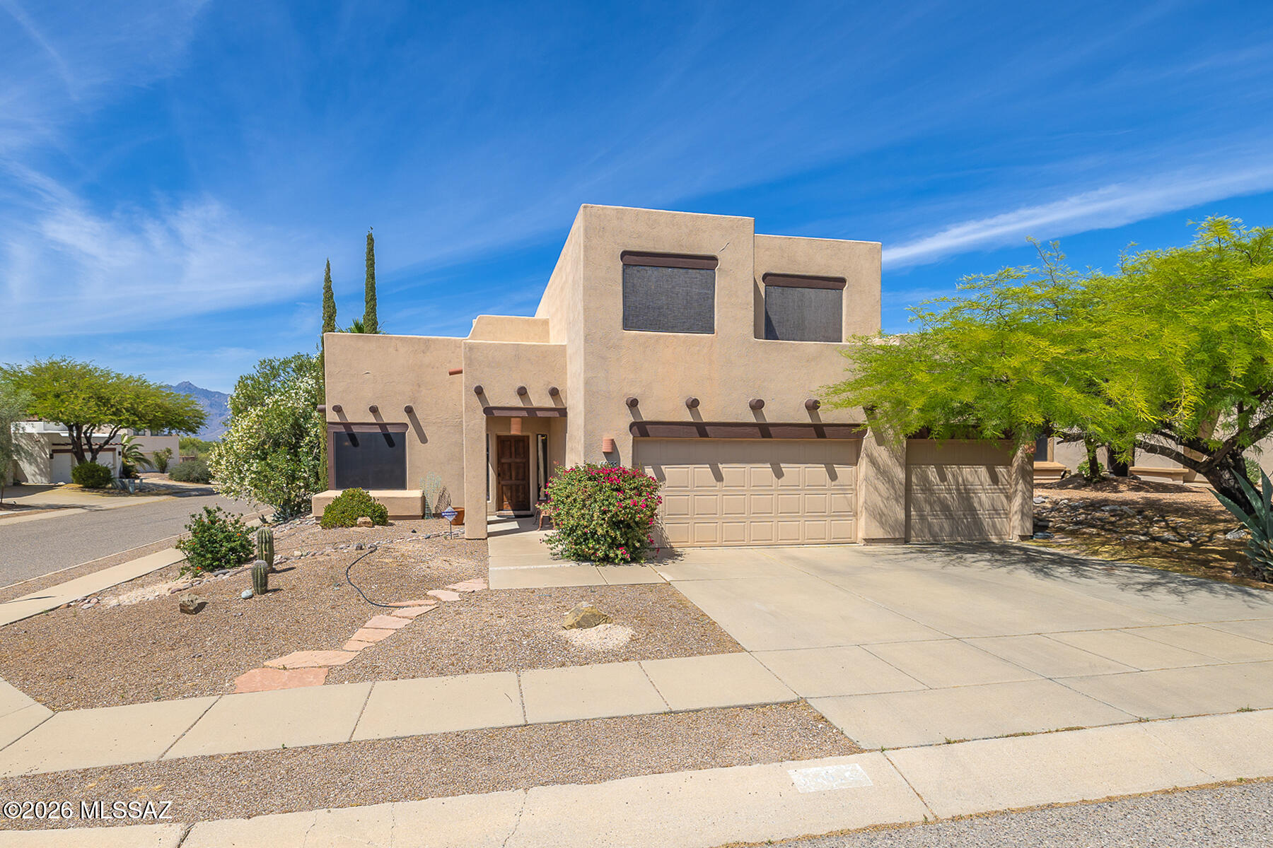 Spacious two-story home in highly sought-after Silverado Hills on Tucson's east side! Offering over 3,000 sq ft, this 5-bedroom, 3-bath home features a versatile floor plan with formal living & dining rooms plus an open-concept kitchen & family/great room with fireplace--perfect for everyday living & entertaining. The kitchen includes a center island with breakfast bar & dining nook. One downstairs bedroom & full bath. Upstairs, step out onto the private balcony and take in the beautiful Catalina & Rincon mountain views. With a 3-car garage and generous living spaces throughout, this home offers comfort, function, and room to grow--all in a convenient location near shopping, dining, and outdoor recreation. Backyard offers a covered patio and hot tub. Call today for your private showing!