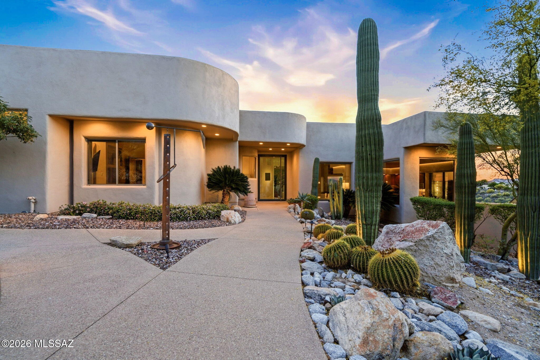 Perched on a prime 1.134-acre corner lot, this fully renovated luxury retreat delivers jaw-dropping 360° city views and breathtaking Catalina Mountain vistas. Evenings sparkle with city lights while you unwind in the infinity-edge pool or spa-like hot tub. Inside, modern elegance meets warmth with live-edge mesquite shelving, custom etched wood accents, and sun-filled oversized windows. The chef's kitchen boasts quartz countertops and high-end appliances. Impeccable landscaping, perfect irrigation, a spacious 4-car garage, and thoughtful upgrades like an in-home vacuum system complete the package. 3 beds, 2.5 baths--this is desert luxury at its finest.

See the documents section for many of the immaculate upgrades.