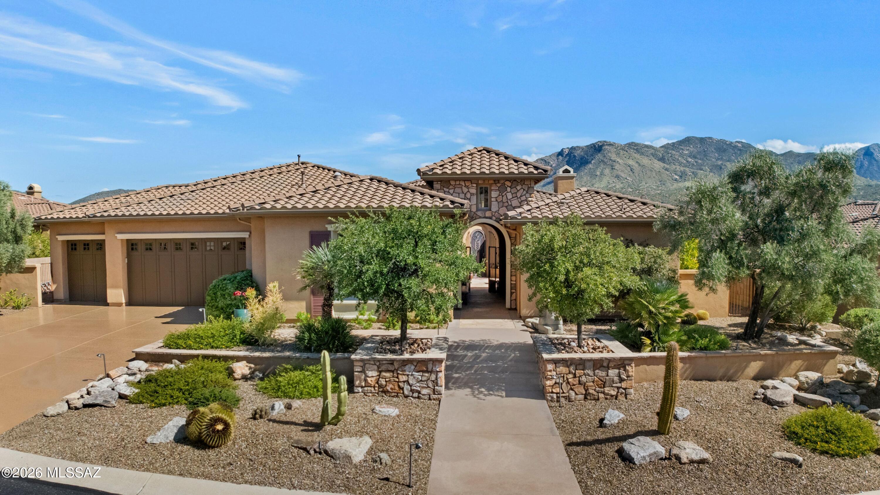 Desirable Sonoran with Guest House, Pool & Mountain Views! Gated Courtyard with Water Feature. Great Room has wall of patio sliders & built-in media wall with Gas Fireplace. Kitchen has Granite Counters, Stainless Appliances, Gas Cooktop,  Cabinetry, Walk-in Pantry & Wet Bar. Kitchen Nook with Patio Slider. Powder Room. Owner's Suite with Patio Slider & EnSuite Bath has Walk-in Shower, Tub & Custom Organized Walk-in Closet. Dining Area plus Den with French Doors & built-in Office System. Guest Bedroom with Closet & EnSuite Bath. Guest House has EnSuite Bath with Shower & Closet. Laundry Room with W/D, Sink & Cabinets. 3-Car Garage with Sink & Cabinets. Covered Patio has 3 Electric Rolling Shades, 3 Heaters & Built-in BBQ Station. Heated/Solar Pool, Water Feature, Hot Tub & Mountain Views!