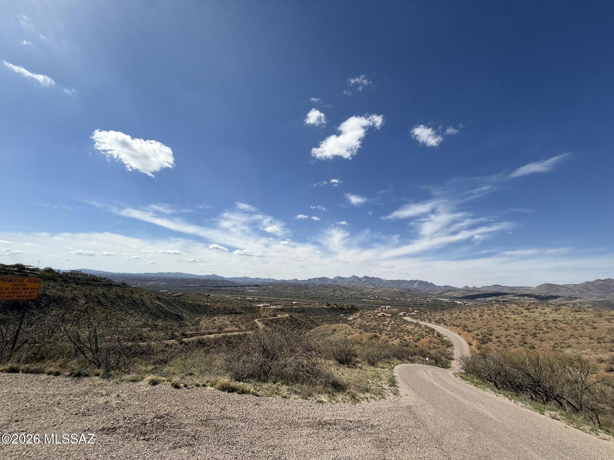 Discover the potential of this beautiful 0.92 acre hill side parcel nestled in the peaceful hills of Rio Rico. Elevated terrain provides sweeping mountain and valley views, offering the perfect setting for a custom home, getaway retreat, or long-term investment. The land features natural desert vegetation, gentle slopes, and a quiet rural atmosphere while still being conveniently close to I-19 for easy access to Nogales, Tucson, shopping, and daily essentials.