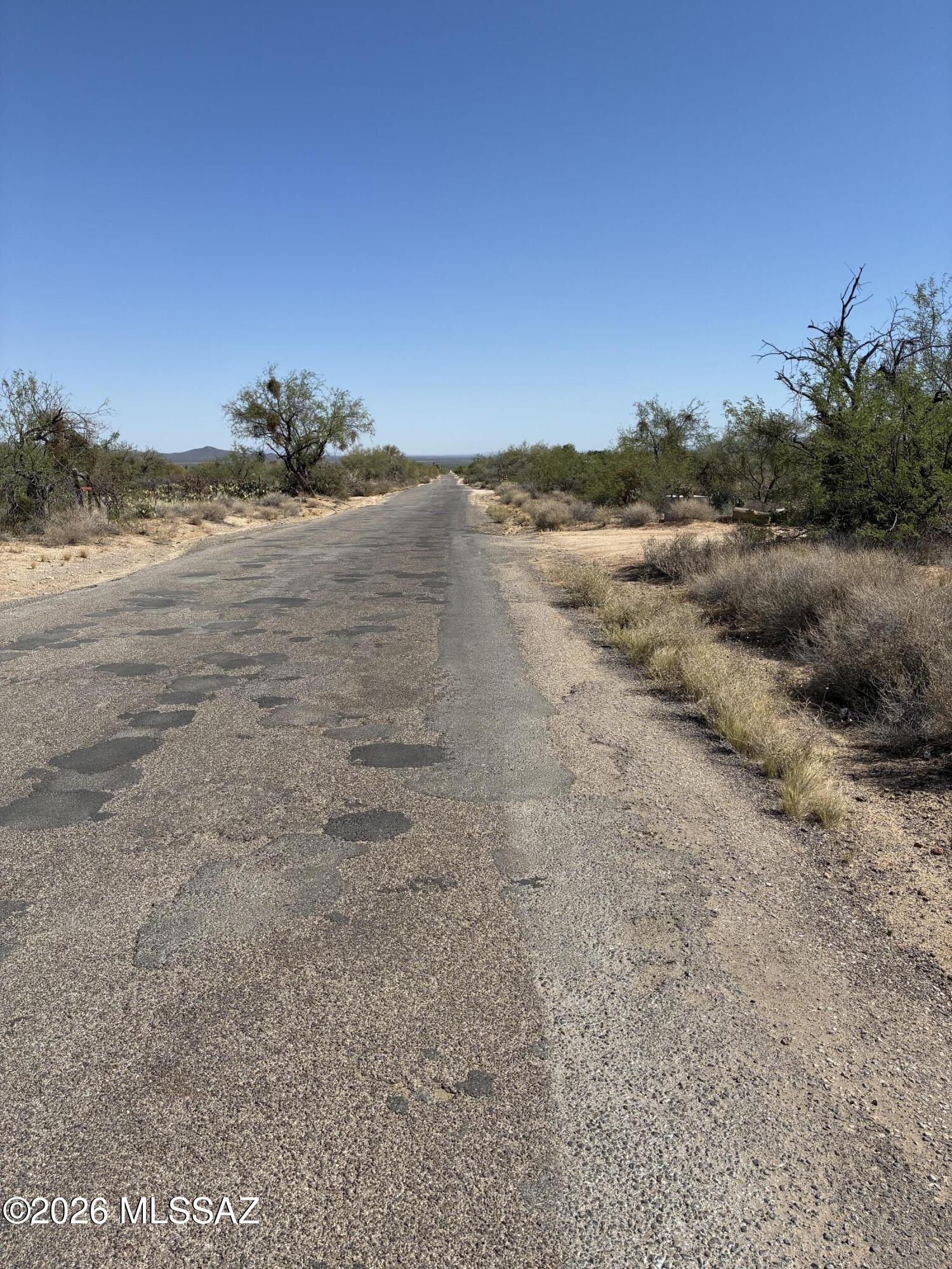1.5 acres of usable land with water, electric, and septic on site.  Ready for a new home. There is a block structure (needs work) on the lot that could be a shop or ?,  There is also a footing for a home near the front of the lot.