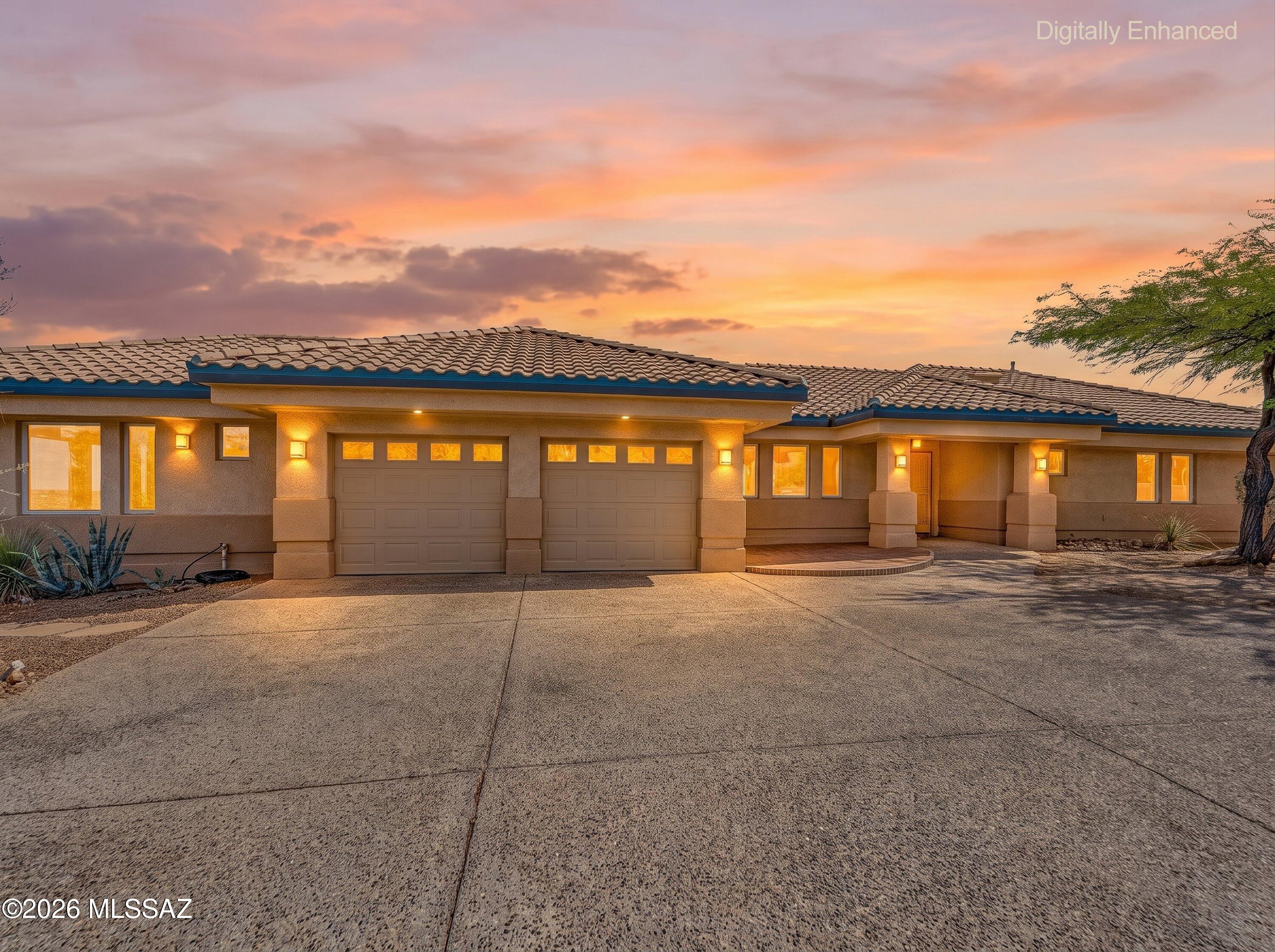 Experience sophisticated desert living in this beautiful single-story contemporary home located in the heart of Oro Valley. This 2BD/2.5BA+Casita (2,567 sqft) elegant residence masterfully blends modern Southwestern charm with an open-concept architectural flow, perfectly designed for individuals seeking an upscale, low-maintenance home with amazing views. Pass through the inviting entry foyer to find an expansive great room floor plan illuminated by high ceilings and broad windows that draw the pristine Southern Arizona sunlight indoors. The central kitchen functions seamlessly as the heart of the home, featuring a functional breakfast bar, custom solid wood cabinetry, and ample space for entertainment. Perfect for casual daily dining or hosting lively weekend gatherings, the culinary hub opens directly into the primary living spaces, ensuring you are always a part of the conversation. The smart floor plan prioritizes owner privacy. The expansive primary suite serves as a true resort-style retreat, complete with a walk-in closet, an elegant master bathroom featuring a deep soaking tub, a separate walk-in shower layout, and a private doorway leading straight to the outdoor spaces. The additional bedrooms offer fantastic versatility, providing ample space for accommodating overnight guests, a specialized fitness room, or a quiet custom home office. Outdoor living is exceptional, featuring a private rear yard fully enclosed by view fence and walls to offer maximum mountain sights. Relax under the deep covered back patio or dine alfresco while soaking in the majestic Catalina Mountain views and manicured fairway backdrops that make this specific neighborhood corridor so legendary. Living on Stargazer Drive grants you unmatched proximity to elite recreational amenities, premier retail at Oro Valley Marketplace, top-tier local schools, and the beautiful multi-use trails of Naranja Park.