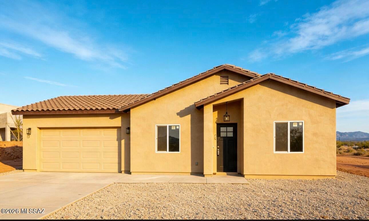 Take a look to this NEW CONSTRUCTION with million dollar views to enjoy everyday sunset. Perfect location close to the Frontage Road and Interstate 19. 1.2 miles to Mountain View Elementary School, 2.6 miles to Coatimundi Middle School and 1.5 miles to Rio Rico High School. The house offers 3 bedrooms, 2 full bathrooms, tile floor throughout the house and a two car garage. The kitchen features quartz countertops, stainless steel appliances and modern finishes. It has an open layout that connects the living and dining areas with great view to enjoy everyday sunset. Still under construction, pictures for illustrative purpose only, final finishes and features may vary.