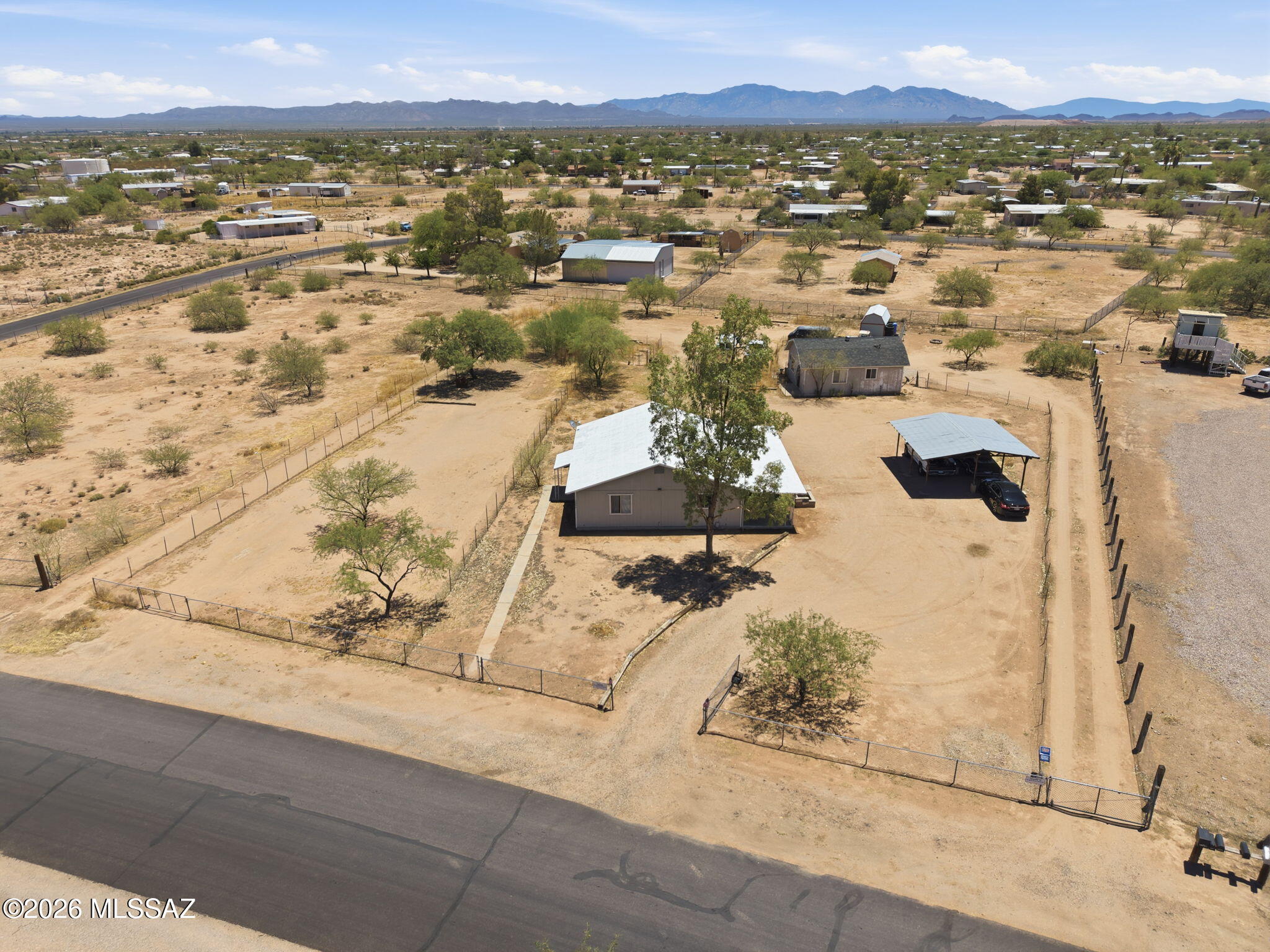 Special opportunity on over 1.09 acres! This unique property features a 2-bedroom, 1-bath main residence plus a detached guest house/studio, offering flexibility for multi-generational living, home office space, hobbies, or potential rental income. Inside you'll find an enlarged living area, open dining space, and a functional kitchen layout. The spacious lot offers plenty of room for RV parking, animals, recreational vehicles, and future expansion. Enjoy peaceful desert surroundings, beautiful mountain views, and the freedom of country living with no HOA. Conveniently located with easy access to Tucson and Marana amenities. A rare chance to own an acre property with multiple structures at an affordable price. Property is being sold as-is.