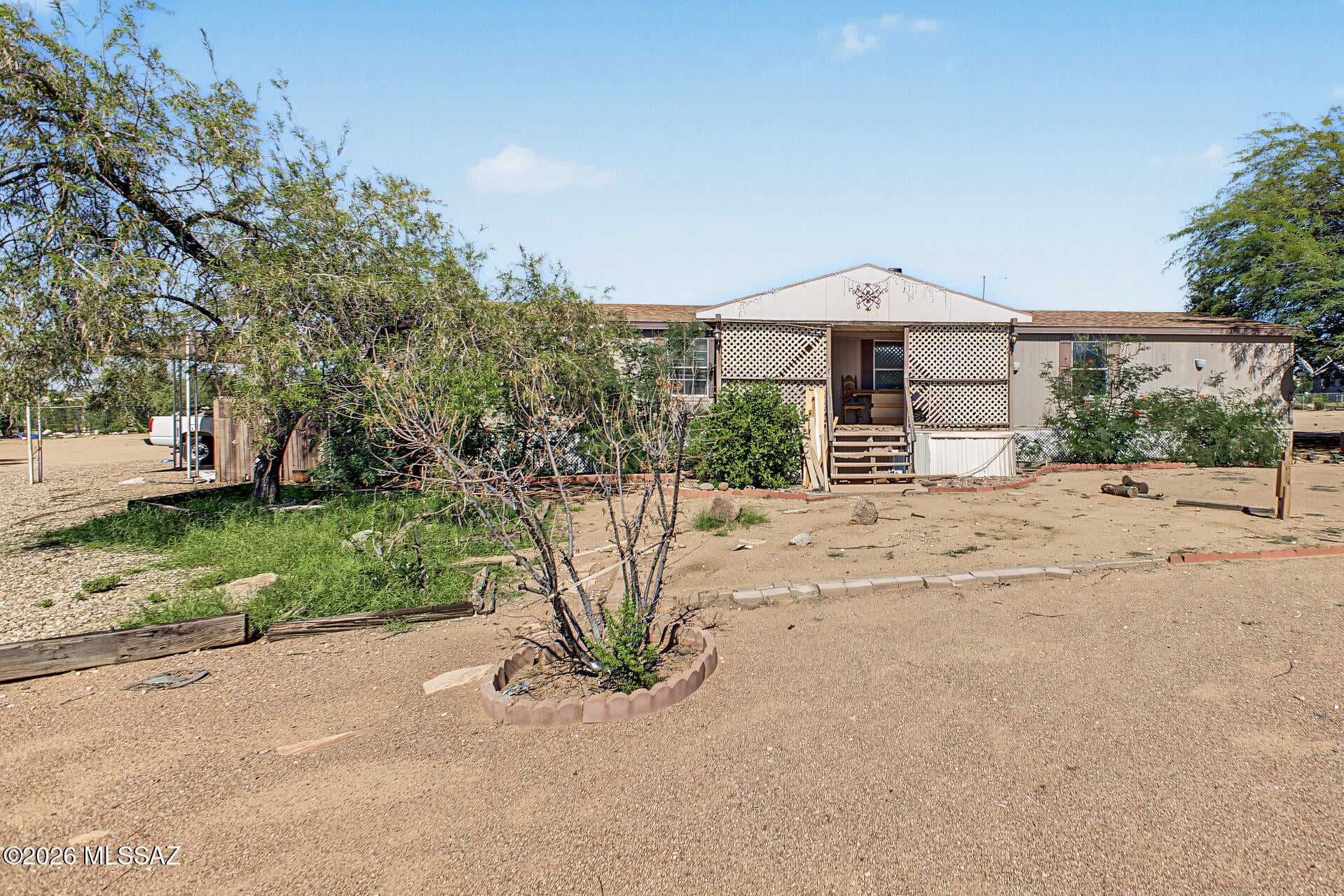 Do not miss this lovely 4-bedroom, 2-bathroom mobile! Sitting on a 1.01-acre lot with horse privilege and beautiful mountain views, it's sure to be the one for you! Inside, you'll discover an inviting layout with tile flooring, carpet in all the right places, vaulted ceilings, crown molding finishes, a cozy fireplace to add warmth, and a neutral palette throughout. The kitchen displays ample cabinetry, plenty of cabinet space, and built-in appliances for a seamless cooking experience. Enjoy a good night's rest in the primary suite, complete with a walk-in closet for easy organization and a bathroom with double sinks and a separate shower & tub. The expansive backyard offers abundant space for future additions, RVs, and horses. Add your personal touch and create your oasis! Welcome home!