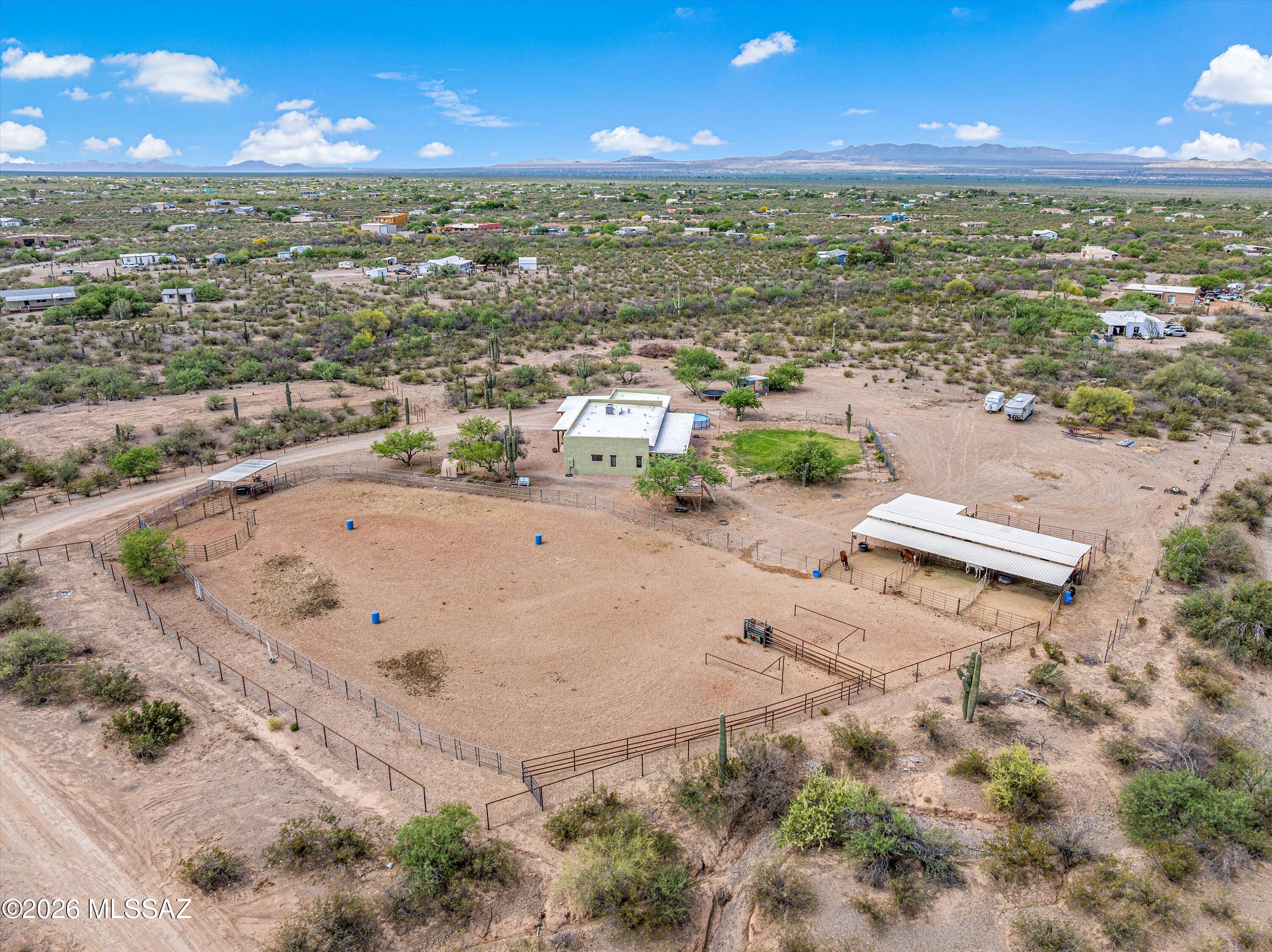 Motivated Seller! Gorgeous 4+ acre horse property featuring a 5-stall mare motel, corral, arena, 10x10 tack room, chicken coop, and more. The land has been thoughtfully cleared and prepared, maximizing usable space and mountain views.

The backyard offers grass alongside a variety of fruit trees--including pomegranate, plum, peach, and apple--plus grapevines and rose bushes. The front yard welcomes you with an elm tree, and just beyond, a true gardener's dream awaits.

Step inside the newly updated home, where you'll find wood-look tile flooring, quartz countertops, and modern finishes throughout. This 4-bedroom, 2-bath home also includes a versatile bonus room with exterior access, easily convertible into a fifth bedroom or private office.

If you're searching for serenity-a place to unwind and reset after a long day--look no further. This home and property are truly a rare find.