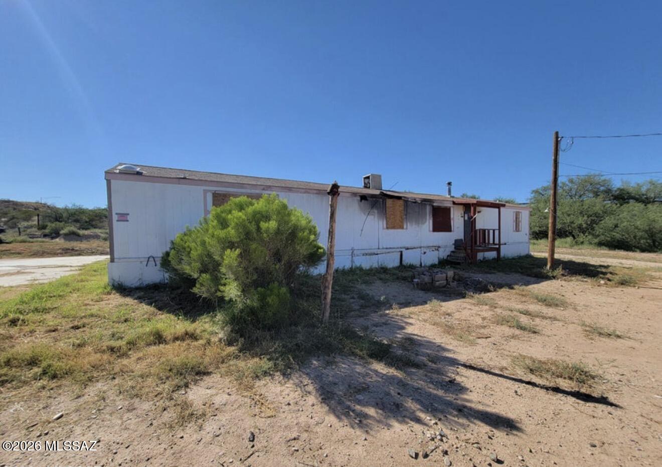 Great Opportunity to own land that has utility hookups installed and a sturdy Manufactured home frame on the lot. This 1987 frame needs a lot of love. It has a great layout all on an acre of land. Conveniently located just minutes away from town and easy access to I-10