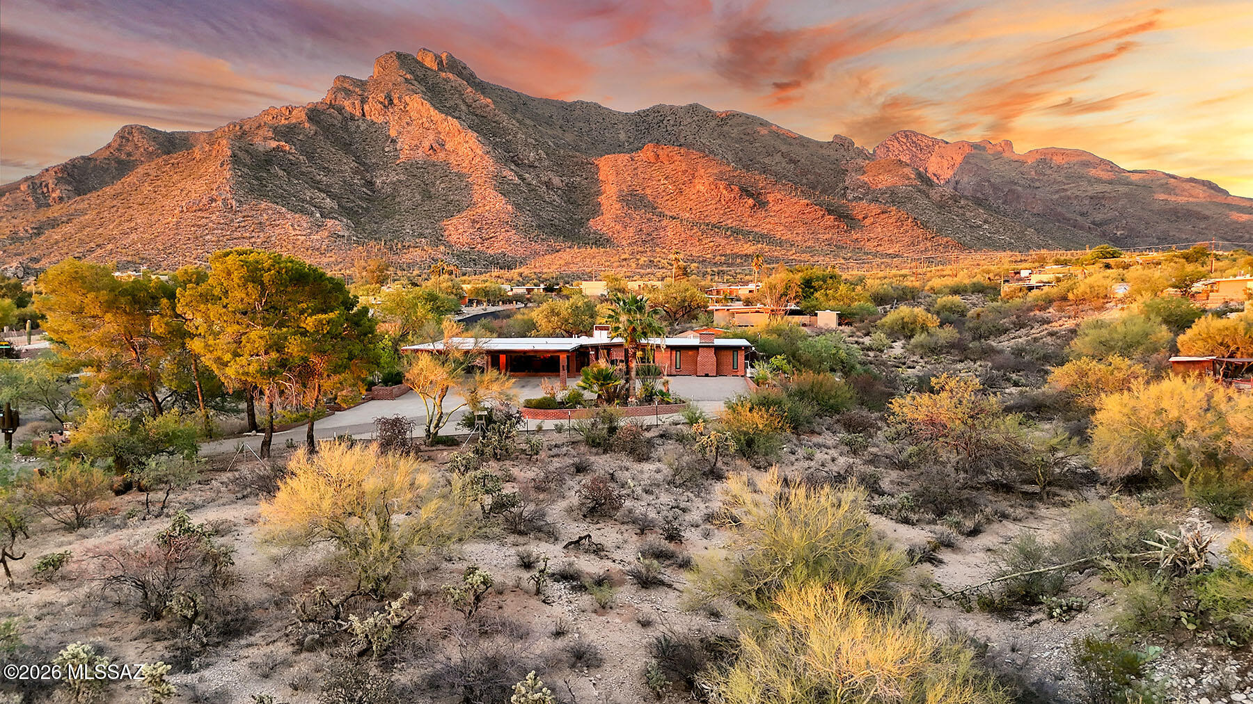 WELCOME to the Highly-Sought After Neighborhood of RANCHO CATALINA! Breathtaking & Panoramic PUSCH RIDGE Mountain VIEWS from this Home Perfectly Situated on a near ACRE Lot offering a Combination of EXTRAORDINARY PRIVACY along with Unbeatable Convenience! This LUXURIOUS 3bd/3ba + Den Residence has been COMPLETELY Updated and offers a blend of Southwestern charm and MODERN Upgrades. Covered Spaces for 6 Vehicles!  The Bright Newly Remodeled COOK'S KITCHEN features QUARTZ COUNTERS, Stainless Steel Appliances, a breakfast nook, and ENORMOUS Walk-In Pantry. This Great Room Floorplan offers TWO Owner's Suites both with Luxurious Private En-Suites. OVERSIZED Laundry room with plenty of room for a Second Refrigerator. Enjoy the Full-Size Built-In SAUNA. You'll find just about EVERTYTHING is... newer including the HVAC, roof coating, and All the Windows!  The RESORT Style Backyard OASIS is a True SANCTUARY with Fabulous Spaces for Entertaining! The backyard features a COMPLETELY ENCLOSED Covered Patio, a Large SPARKLING Pool & Hot Tub, GAZEBO, and Absolutely STUNNING MOUNTAIN VIEWS! Located at the Base of the Catalinas in Convenient Oro Valley and just minutes from Shopping, Dining, and Literally Walking Distance to Hiking Trails in the Catalina Foothills and No HOA. Welcome Home!