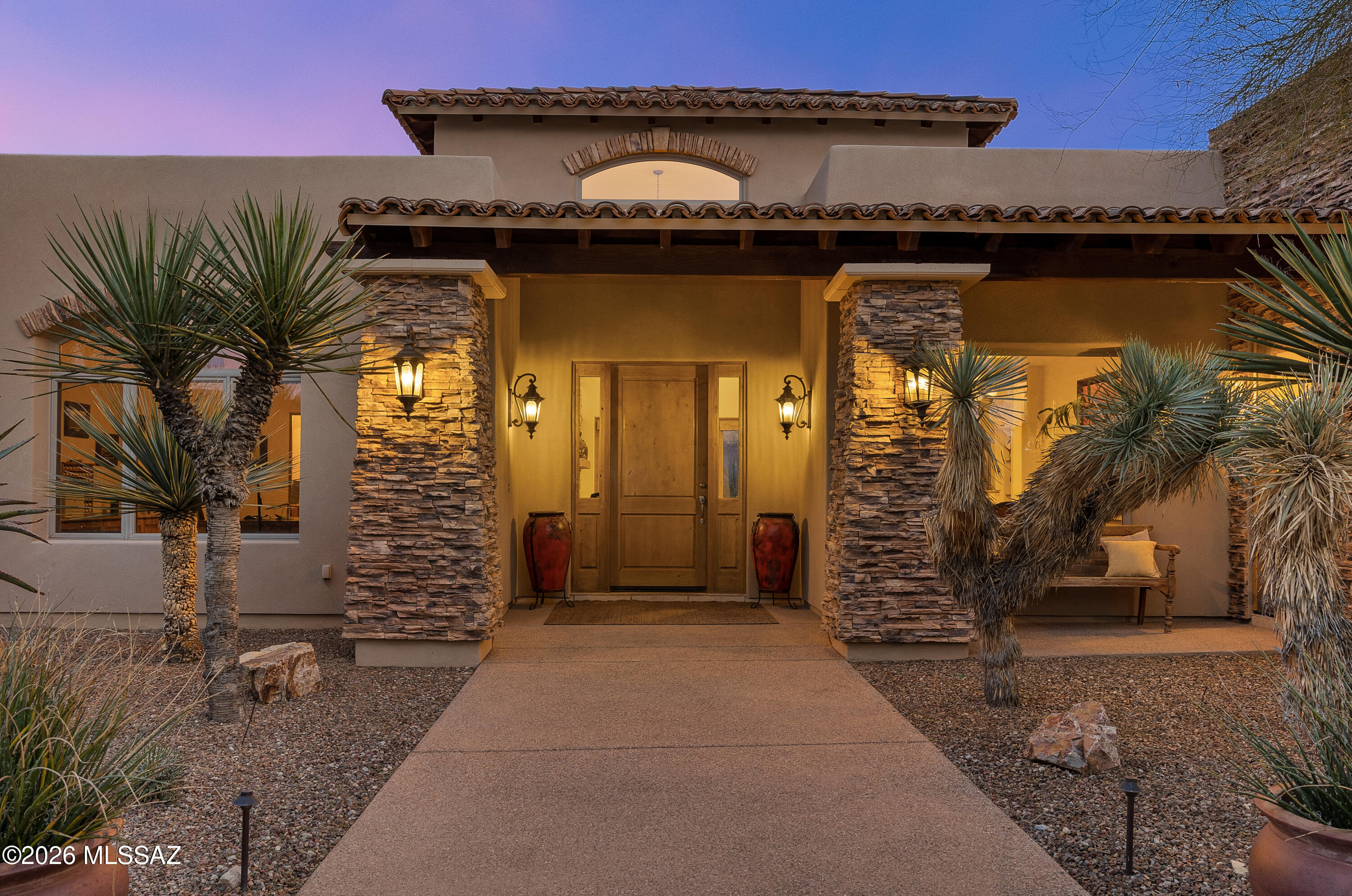 Set on one of Stone Canyon's nearly two-acre homesites, overlooking Vistoso Trails Nature Preserve (acres of open space), capturing breathtaking, unobstructed east-facing views of the Catalina Mountains that feel endless, dramatic, and provides those beautiful ever changing colors you can enjoy every evening. The setting is exceptional and the expansive backyard is designed for both everyday enjoyment and large-scale entertaining. Spanning over 4,400 square feet, the home features a thoughtful split floor plan. Multiple gathering spaces include a formal living room, an inviting great room with fireplace, breakfast bar, breakfast nook, and formal dining room ideal for hosting. A private office with its own full bathroom provides flexibility for work, guests, or additional living needs. The detached casita, connected by a breezeway, offers excellent privacy for visitors, while the three-car garage and large circular motor court provide ample space for vehicles and effortless hosting during family gatherings and events.

Outdoors, the backyard is a true extension of the home's living space. A flagstone patio frames a resort-style pool and spa, complemented by a pergola with built-in barbecue and generous countertop space. A fire pit creates a perfect setting for evenings, all set against the dramatic Catalina Mountain backdrop that defines this extraordinary property.

Offered fully furnished, this residence presents an opportunity to step directly into the Stone Canyon lifestylewhere privacy, scale, and outstanding views come together in one of Oro Valley's most prestigious gated communities.