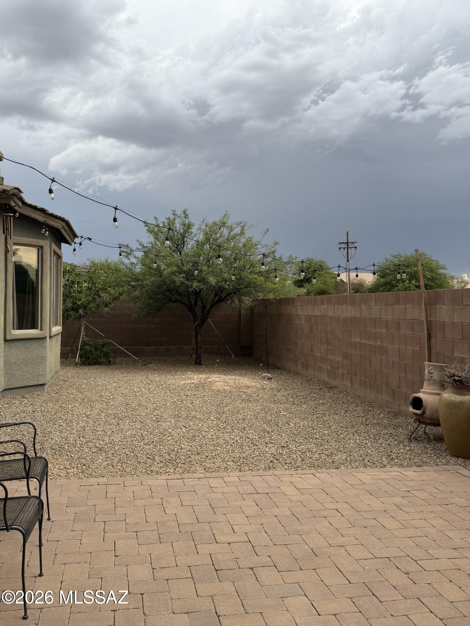 Absolutely stunning home in the lovely Desert Enclave neighborhood. A wood gate leads to a private, bricked courtyard with beautiful Rincon Mountain views. The large foyer welcomes you into an open living area featuring a gorgeous stone wall. The kitchen offers custom cabinets, granite counters, stainless steel appliances, a double oven, and a dishwasher. The dining area includes a custom ceiling, bay windows, and access to the covered patio. The home features a spacious laundry room with access to the wide, bricked side yard. Other highlights include a large primary suite, custom bathrooms, and an oversized office/bedroom.