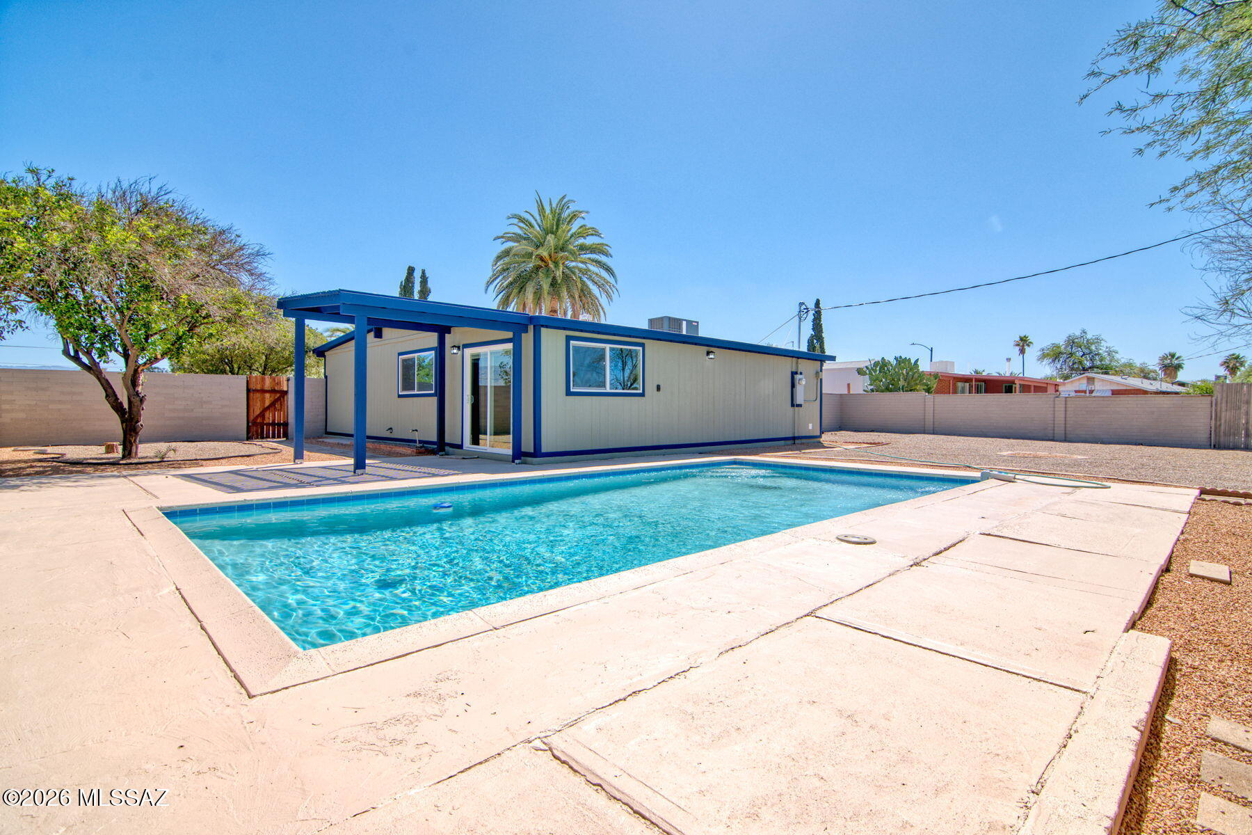 Range priced seller will entertain offers between $365,000 and $375,000. This 1956 built red brick mid-century home has been lovingly restored to better than new condition. New energy efficient windows, new kitchen, with quartz counter tops, wood accents, pendant lighting with a huge island. New custom concrete flooring an open great room plan and so much more. It is 1956 on the outside and all of the functions and amenities you would expect from a new home. Put this home on your short list. The home sits on a a .19 acre lot with a sparkling pool and large patio surrounded by a block wall.  Owner/Agent