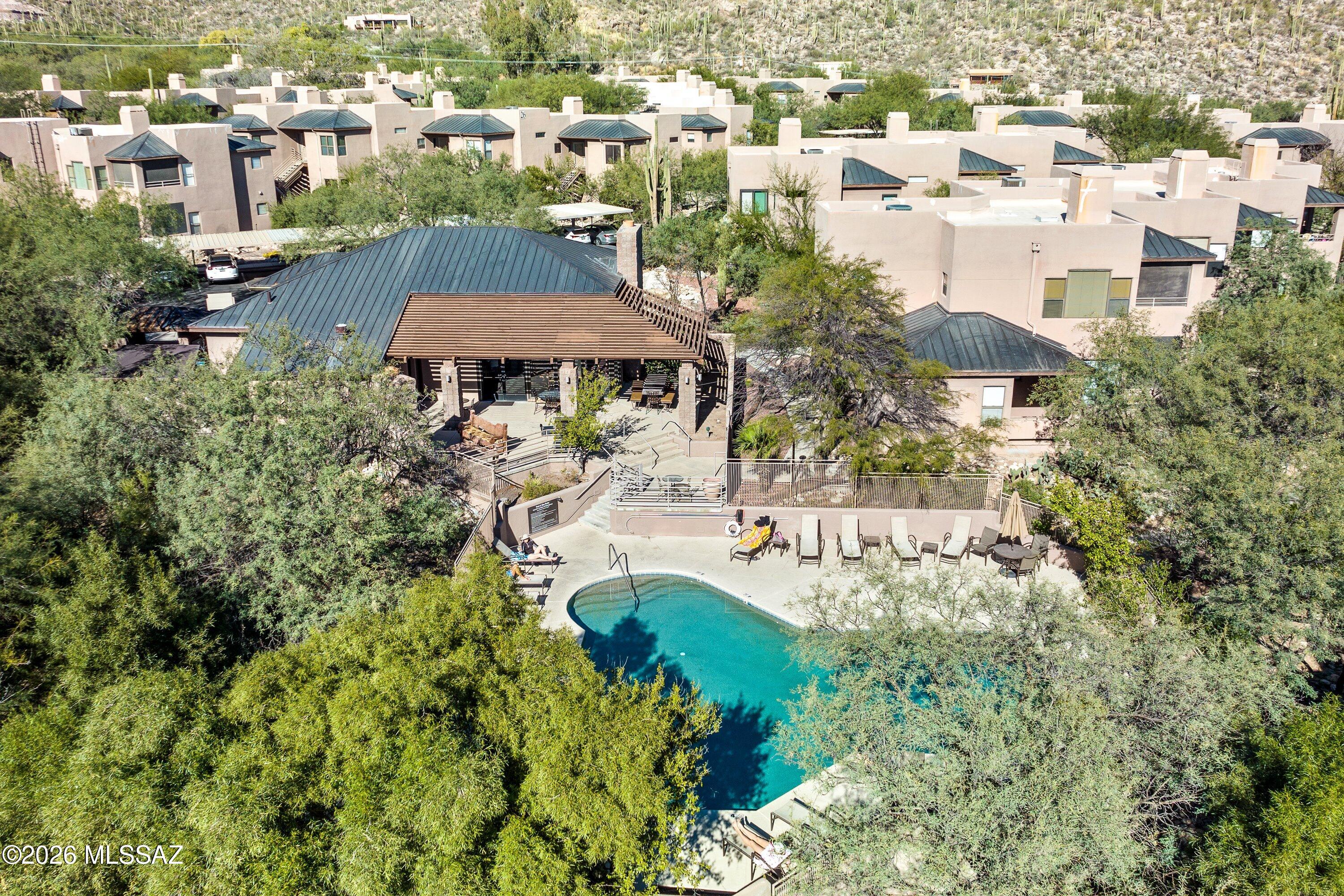 Incredible opportunity to own a beautiful 2-bedroom, 2-bathroom condo in one of the Foothills' most coveted communities--Canyon View at Ventana. Ideally situated at the base of the Ventana Canyon hiking trail and neighboring the renowned Loews Ventana Canyon Resort and Ventana Canyon Country Club, this pristine location offers an exceptional blend of natural beauty, resort-style amenities, and elevated desert living. 

The bright, inviting kitchen features granite countertops and backsplash, stainless steel appliances including double ovens, newly upgraded cabinetry, and abundant storage. A spacious dining area opens seamlessly from the kitchen and connects to the patio, creating a light-filled space perfect for everyday living or entertaining. The generously sized primary suite offers its own ensuite bathroom, walk-in closet, and convenient access to the laundry room. A desirable split-bedroom floor plan provides privacy for guests, while luxurious carpeting throughout the living areas adds warmth and comfort to the home. 

Ideally located between the community's two clubhouses, you'll have an array of resort-style amenities just steps away. Relax by the pools and spas, work out in the newly upgraded fitness center, enjoy pickleball or tennis, or take advantage of the community's private entrance to the highly sought-after Ventana Canyon Trailhead. Experience the best of Tucson's Sonoran Desert with stunning canyon views, world-class golf, scenic cycling routes, exceptional restaurants, and premier shopping all nearby. 

The surrounding desert landscape is alive with abundant wildlife, offering frequent glimpses of native birds, javelina, rabbits, and other Sonoran Desert wildlife right outside your door.

With no rental restrictions, this exceptional property offers the flexibility to serve as your personal desert retreat, a seasonal getaway, or a compelling investment opportunity. Come discover the beauty, lifestyle, and endless possibilities of Canyon View at Ventana.
