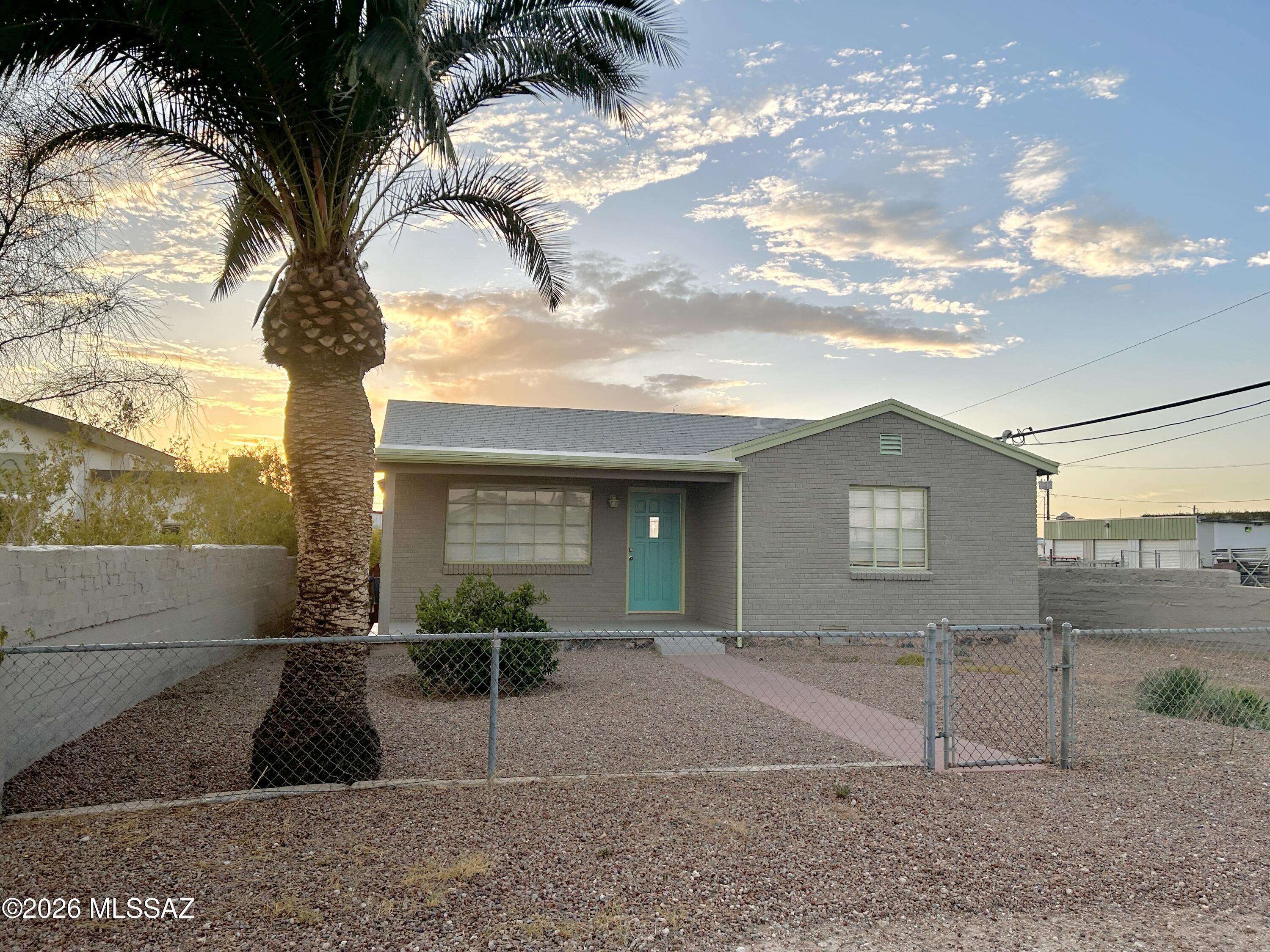 Charming 1952 brick home near Downtown Tucson! Live just minutes from downtown dining, coffee shops, nightlife, and only one mile from the University of Arizona. This home blends vintage character with modern comfort in an unbeatable location.

• 2 spacious bedrooms
• Bonus flex room - perfect for office, studio, or guest space
• Beautiful wood floors + ceramic tile
• Fresh interior paint
• Central A/C for year-round comfort
• Updated kitchen with like-new cabinets & appliances
• Tub and shower recently updated.
• Laundry room with washer & dryer

Enjoy fully fenced front & back yards, a sunny front porch for morning coffee, and a shaded back porch ideal for relaxing after a downtown evening. Convenient access to bus routes and major employers.  Pets approved on