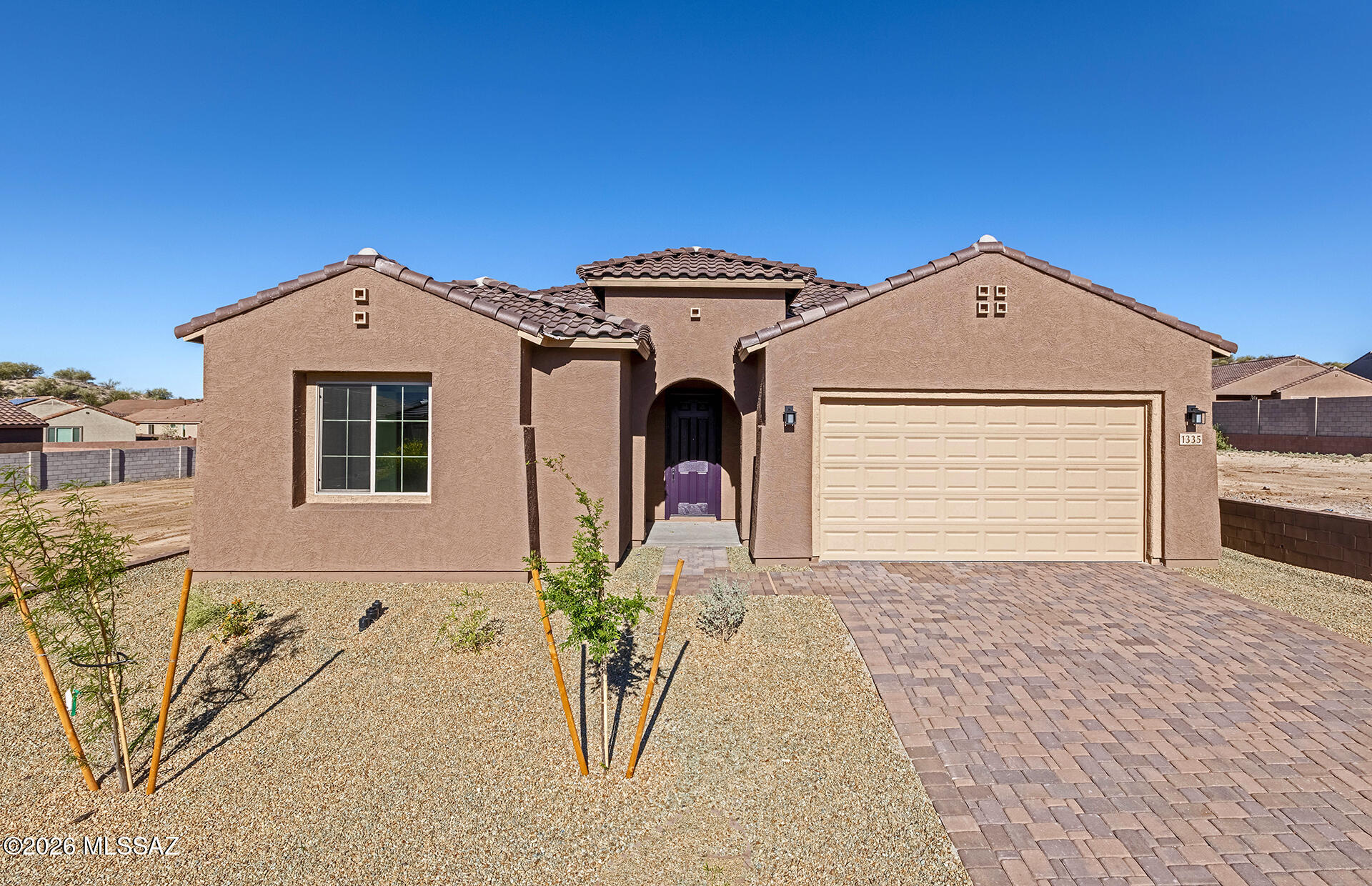 Move-in ready April 2026. This brand-new designer home features a split floor plan with Spanish-style exterior and paver driveway/walkway. Chef's kitchen includes gas cooktop, SS Whirlpool appliances, 4-door refrigerator, Coastal Shaker taupe cabinets, Terra Sol quartz, and custom backsplash. Owner's bath and Bath 2 match kitchen quartz. Upgrades include 12x24 Lagos tile. Energy-efficient features: tankless water heater, low-flow fixtures, dual-pane windows, and more