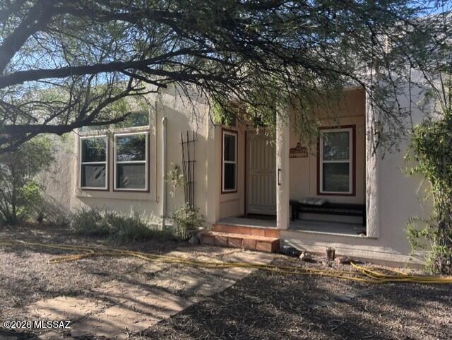 Welcome to your ideal desert retreat! Located on a spacious corner lot in Mescal, this beautiful Santa Fe style 3-bedroom, 2-bathroom home offers 1,750 square feet of comfortable, energy-efficient living space. Features brand-new kitchen cabinets with granite countertops--perfect for home cooks & laminate flooring throughout. Equipped with fully owned solar panels to keep energy bills low year-round. Recently painted exterior (Rhinosheild 2025) with warranty, for low maintenance. Outfitted with a whole-house water filtration system for clean, high-quality water at every tap. This property includes a large 14 x 20 workshop with added storage overhead, plus a 1-car carport. The entire perimeter is completely fenced with a straw bale stucco wall providing added privacy & security for pets or outdoor activities. Whether you're looking for extra workshop space, modern interior finishes, or long-term utility savings, this turnkey property has it al