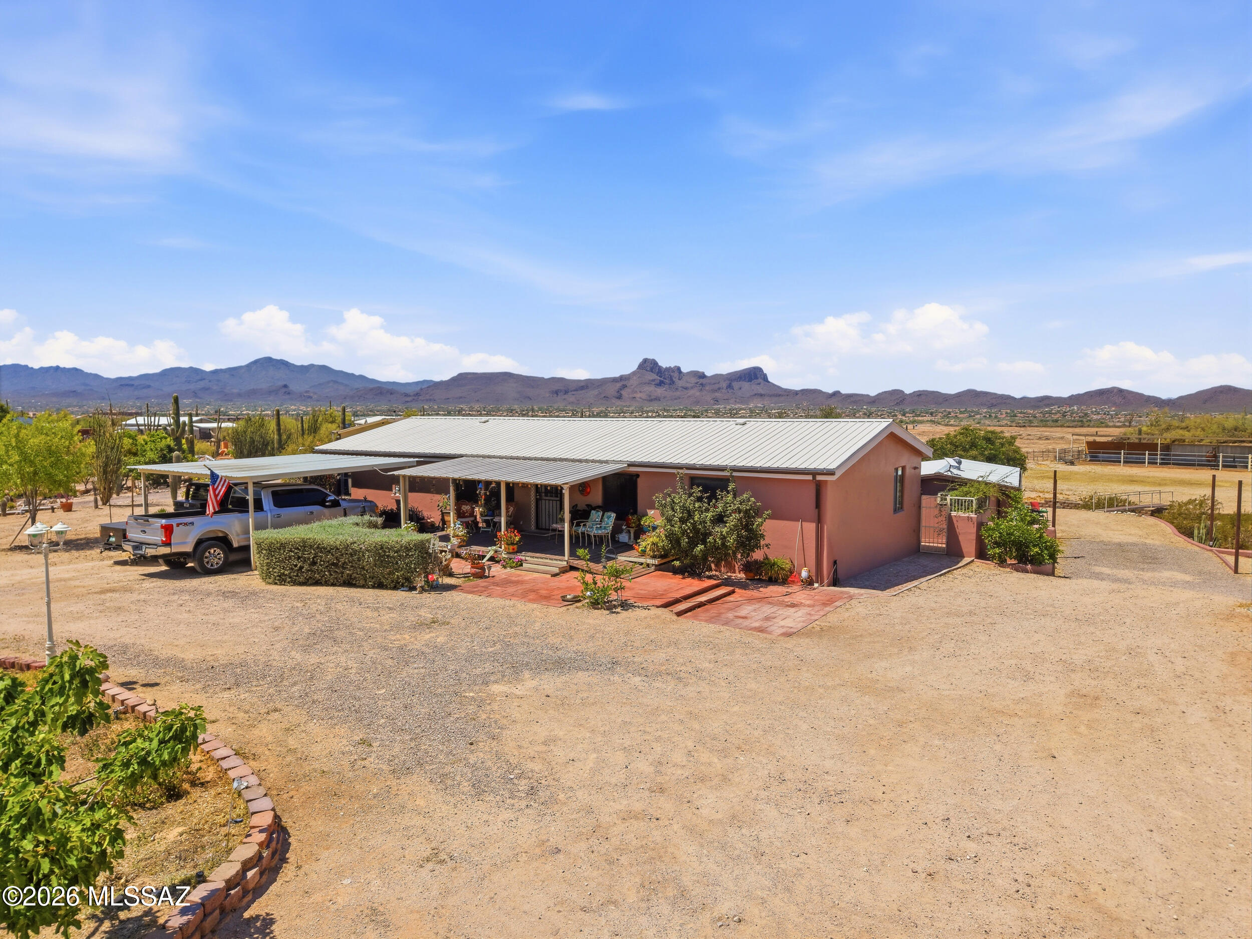 Situated on just over an acre of horse property complete with corrals, stables, & a tack room, this 3-bedroom, 2-bath manufactured home won't disappoint. The open-concept layout includes a versatile den perfect for an office, playroom, or extra living space. An unpermitted casita studio offers additional flexibility for guests, hobbies, or storage.  Surrounded by gorgeous sunsets & stunning mountain views, there's plenty of room for all your toys, including RV parking & hookups. Enjoy peaceful country living with space for animals, entertaining, & outdoor living while still being conveniently located near town amenities.