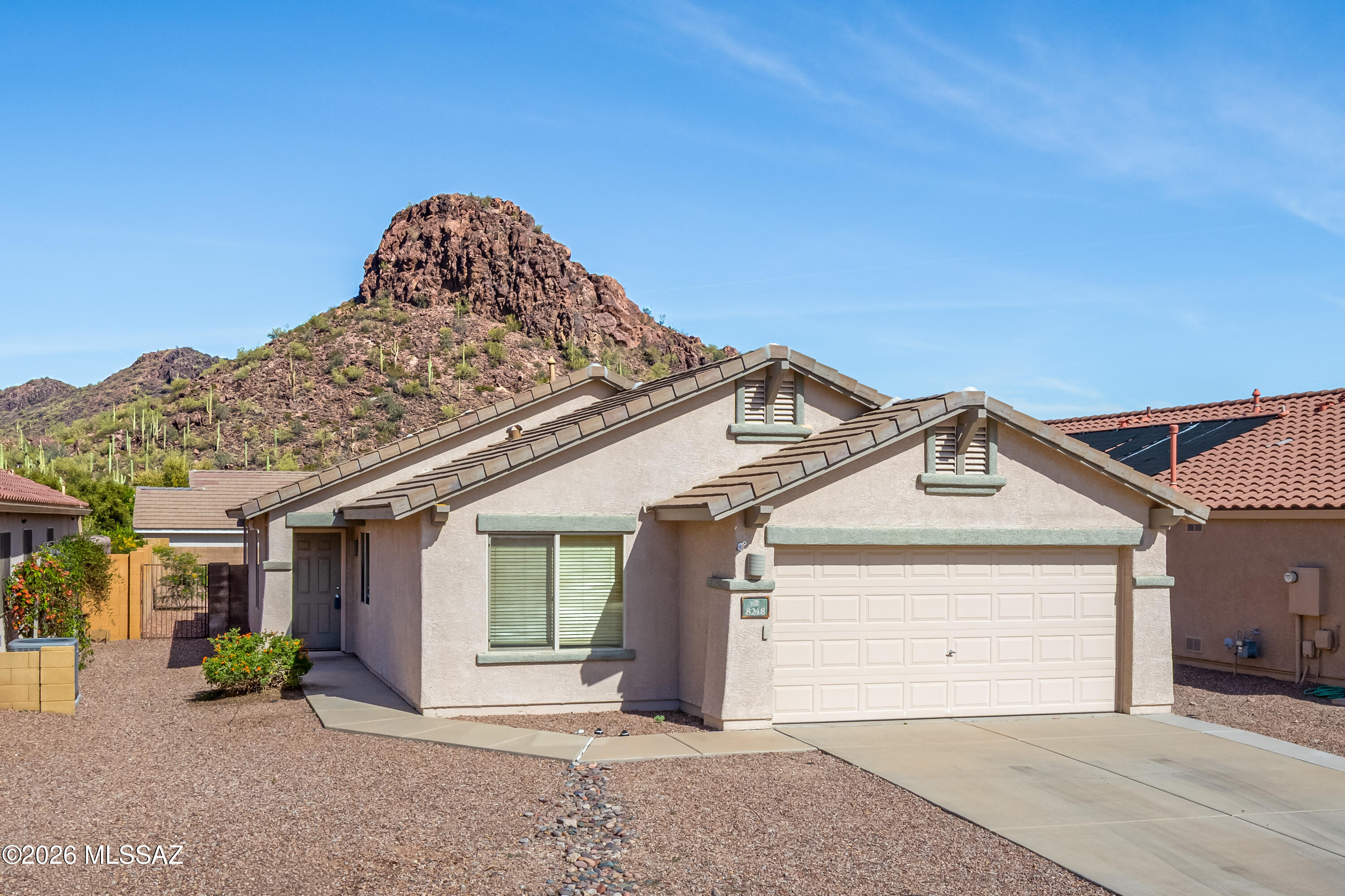 Well-maintained 3BR/2BA single-story home in the desirable Sonoran Vista at Continental Ranch. Built by Pulte in 2003, this 1,618sf home sits on a premium mountain-view lot tucked away at the end of a quiet street, offering privacy with convenience. Home features no-carpet interior & functional split-bedroom floor plan w/secondary bedrooms separated from primary suite. Primary suite includes an ensuite bath & walk-in closet. Kitchen offers a casual dining area & opens to family room w/sliding glass doors to patio, creating an easy indoor-outdoor flow for everyday living and entertaining. All appliances are included, making this home truly move-in ready. The nearby Continental Ranch Community Public park includes a state-of-the-art skate park, splash pad, tennis courts, baseball fields perfect for community events or casual games & scenic walking paths, pool and  picnic tables & gazebos. Ideally located near I-10, this home offers quick access to Marana and Northwest Tucson, with shopping, dining, Tucson Premium Outlets, and Topgolf just minutes away. Outdoor enthusiasts will appreciate proximity to Saguaro National Park, El Rio Preserve, and "The Loop," providing easy connections to parks, trailheads, bike and bus routes, schools, workplaces, restaurants, and entertainment. Miles of hiking and biking trails showcase the natural beauty of the Sonoran Desert. Low HOA dues and a highly sought-after location make this an excellent opportunity to enjoy comfort, views, and convenience in one of Tucson's most popular master-planned communities.