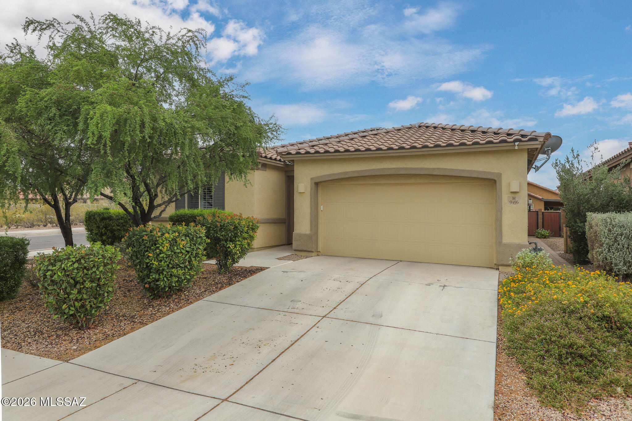 Beautifully maintained and move-in ready, this stunning corner-lot home offers the perfect blend of comfort, style, and convenience within the Vail School District.  Featuring 3 spacious bedrooms plus a versatile den, 2.5 bathrooms, and a 2-car garage, this home has room for everyone. The upgraded kitchen is a true standout with modern finishes and plenty of space for cooking and entertaining. Enjoy elegant shutters throughout, no carpet for easy maintenance, and a fully landscaped yard designed for outdoor enjoyment. Take in the beautiful mountain views from your own home while enjoying a prime location close to shopping, dining, and everyday conveniences. This is the one you've been waiting for! Schedule a showing today.
