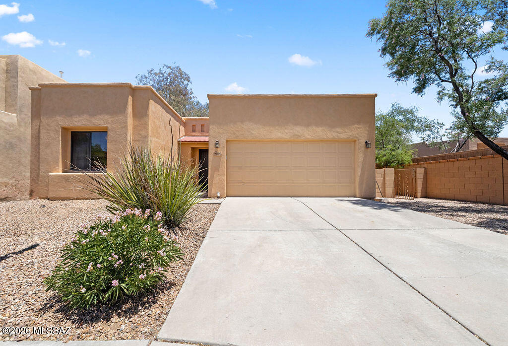 Gated community • Desert Links HOA • 3 bed/2 bath • 1,731 sq ft • Private pool • Near Udall Park

Set in the gated Tucson community Red Adobe Pass, 2506 N Blue Willow Trail offers a single-level layout with 3 bedrooms, 2 baths, 1,731 sq ft, and an attached 2-car garage. The open living and dining area features tile flooring, recessed lighting, ceiling fans, a fireplace, and sliding glass door to the backyard. The kitchen includes wood-tone cabinetry, stainless steel appliances, gas range, built-in microwave, and island or peninsula seating. Outdoor spaces include a private pool, covered patio, walled backyard, desert landscaping, palms, and grill area. Built in 2005, this east-side Tucson home is near Udall Park, shopping, dining, and services.