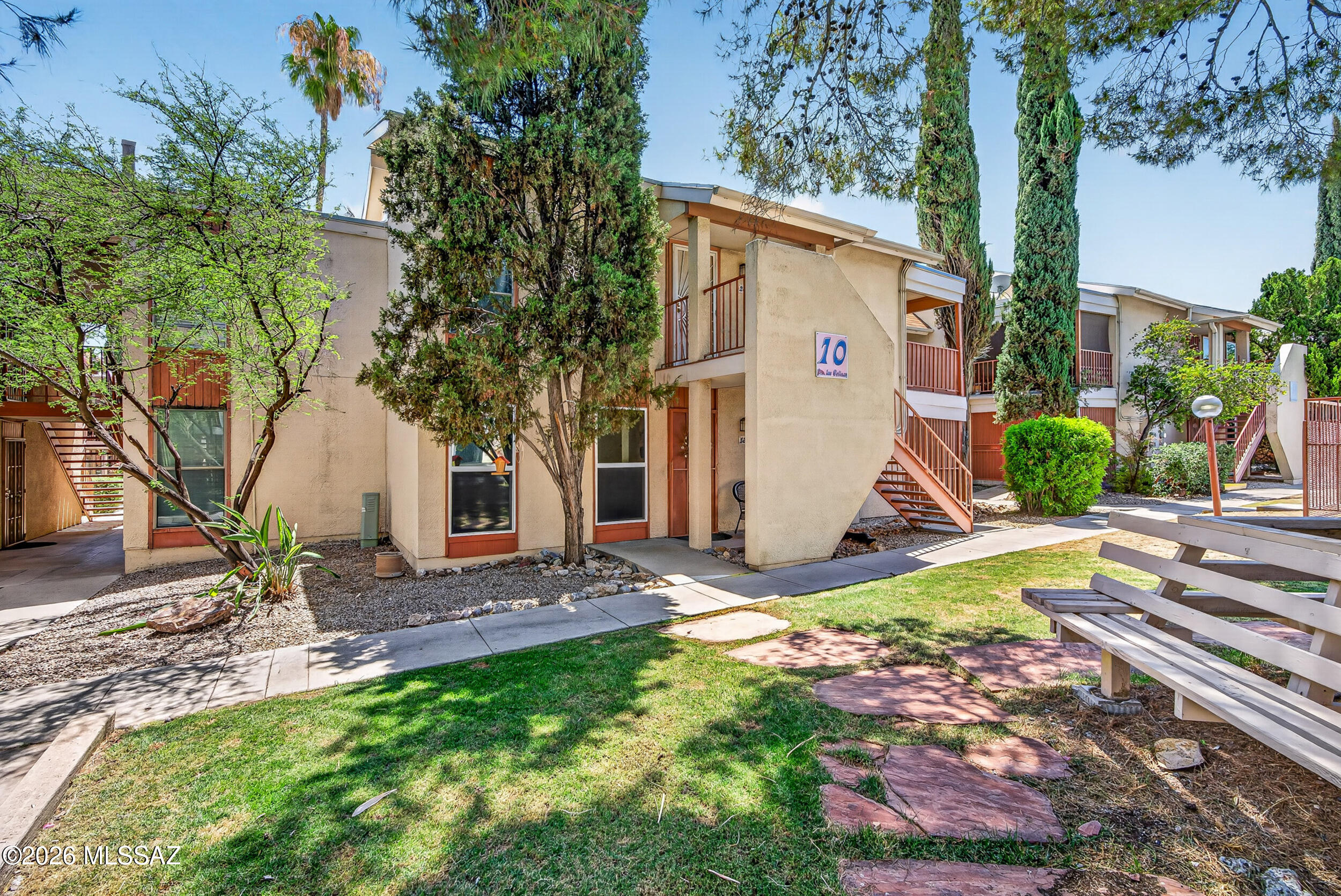 Discover affordable Tucson living in this move-in ready ground-floor condo located in the desirable Las Colinas community. This 1-bedroom, 1-bath home features wood-look tile flooring, warm brick accents, abundant natural light, a spacious walk-in closet, and a private fully screened covered patio. Enjoy the convenience of easy first-floor access with no stairs, covered parking, and access to community amenities including two sparkling pools and beautifully maintained grounds. The HOA covers water, trash, exterior maintenance, and roof maintenance. Conveniently located near shopping, dining, medical facilities, and everyday essentials, this low-maintenance home is perfect as a primary residence, seasonal retreat, or investment opportunity.