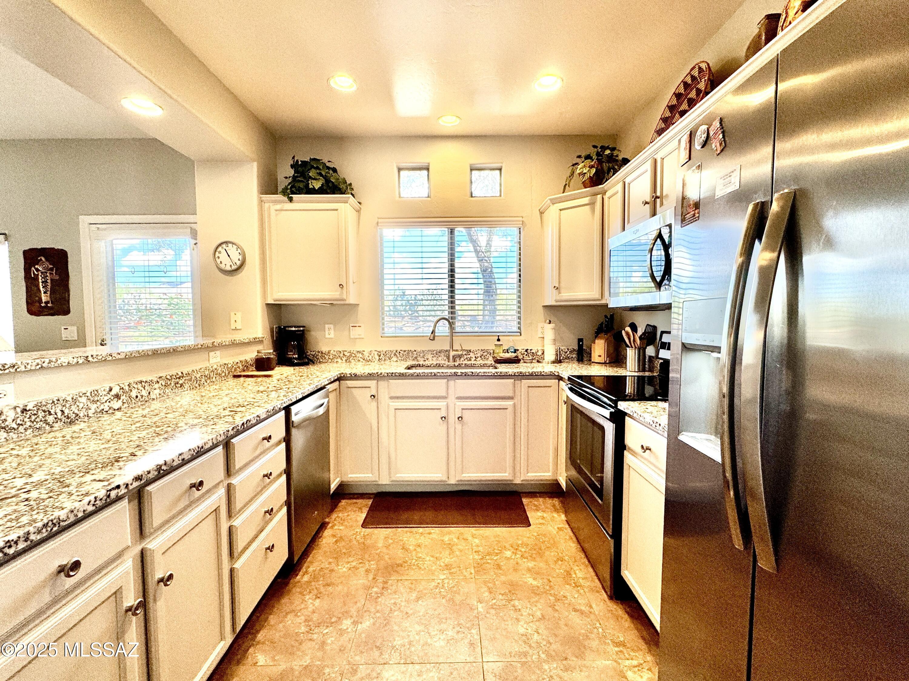 Beautiful 2-bedroom, 2-bath condo located in the sought-after Vistoso Resort Casitas. This spacious 1,240-square-foot home features an open floor plan, comfortable living spaces, and generously sized bedrooms. Enjoy a prime Oro Valley location just minutes from shopping, dining, golf, hiking trails, and other outdoor recreation. Experience the perfect blend of comfort, convenience, and resort-style living.