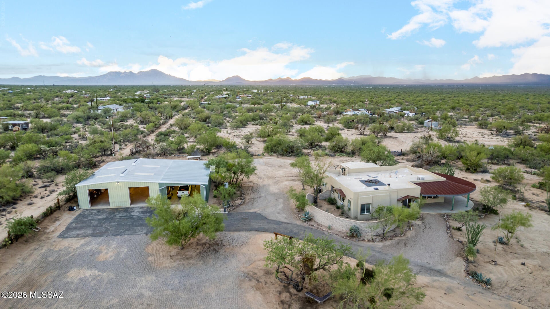Set on an impressive 3.7-acre corner lot, this one-of-a-kind Tucson property offers the space, privacy, and versatility that are hard to find! Car enthusiasts and hobbyists will love the 5-car detached garage complete with a car lift and its own office and bathroom, offering incredible room for vehicles, projects, toys, and storage. Inside, vaulted ceilings and abundant natural light create an inviting atmosphere, while the wood-burning fireplace adds warmth and character. The kitchen features stainless steel appliances, ample cabinetry, a center island with breakfast bar, and an adjoining dining area. The primary suite includes a private bath and walk-in closet. An Arizona room and den add even more usable space. With 3.7 acres, exceptional garage space, multiple living areas, and plenty of room to spread out, this property offers a rare combination of space and functionality!