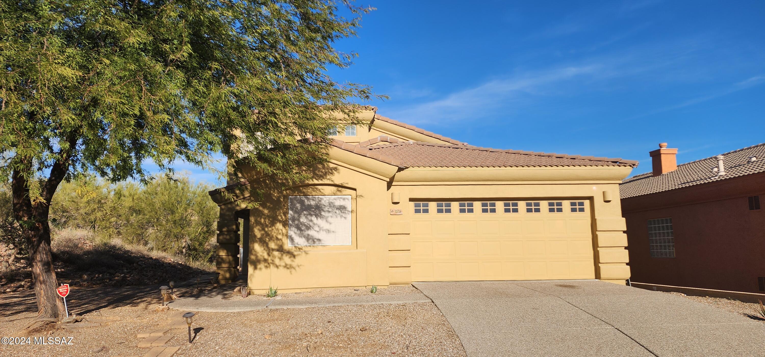 Spacious 5-bedroom, 3-bath home with stunning Catalina Mountain views and a thoughtfully designed layout. The open-concept main level features vaulted ceilings in the great room, creating a bright, airy atmosphere with an inviting sense of space. A highly desirable floor plan places the primary suite on the first floor, along with an additional bedroom, a versatile den or office that can also serve as a bedroom, a laundry room, and a full guest bath. Upstairs, you'll find two additional guest bedrooms and a generous private loft, offering a comfortable retreat for family or visitors. The well-appointed kitchen is ideal for everyday living and entertaining, with abundant cabinetry, granite countertops, a center island with bar seating, and a double oven. Conveniently located in Oro Valley,