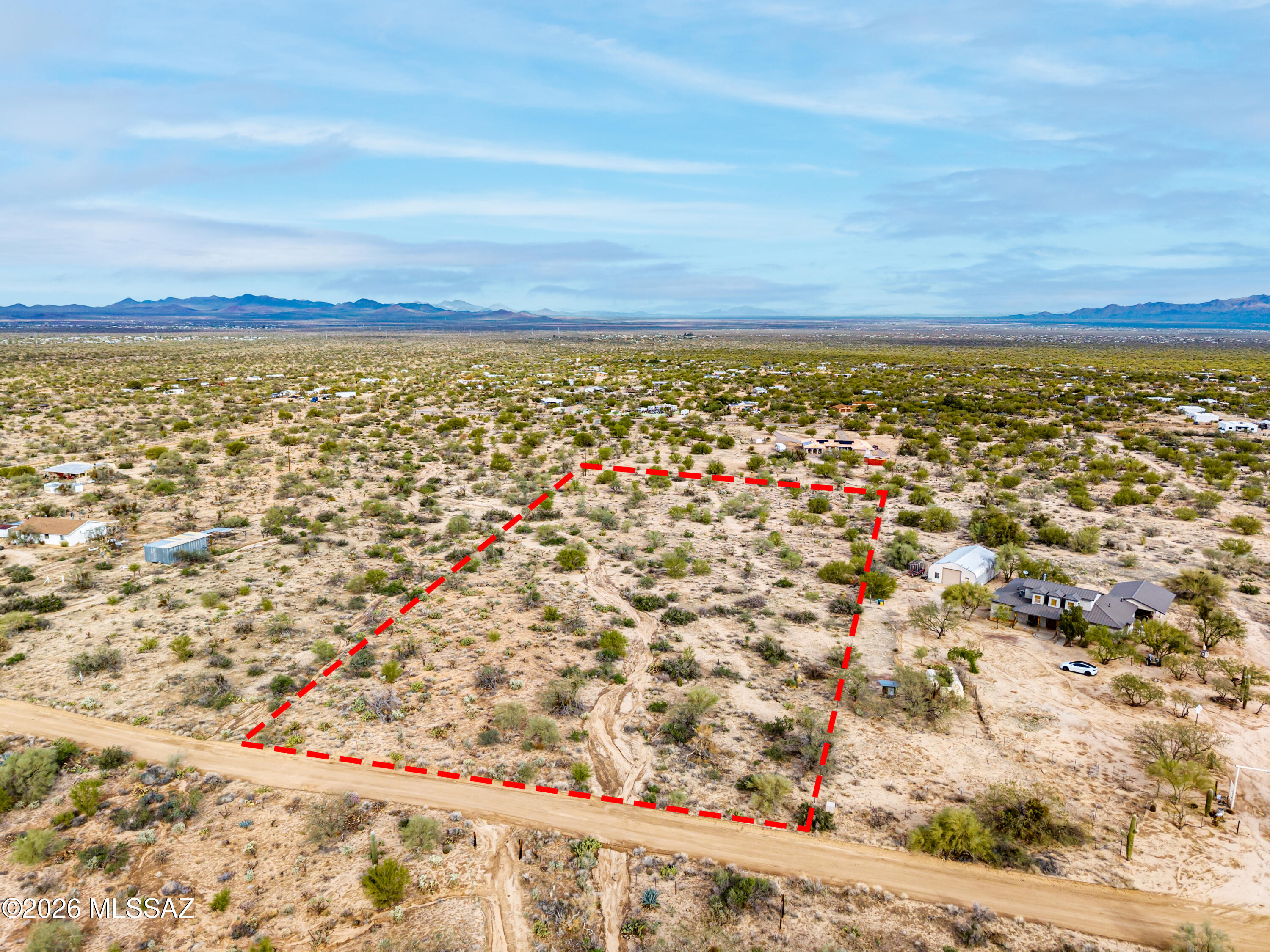 4.84 acre parcel with flexible land use potential in Pima County SR zoning. Potential lot split opportunities may exist subject to Pima County approval. Buyer to verify zoning, land division potential, utilities, access, and all development requirements. Agricultural and ranch uses may include field crops, truck gardening, berries, tree crops, flower gardens, nurseries, orchards, aviaries, livestock (excluding swine), and more (restrictions apply). Cluster development options may also be available. Ideal for an investment opportunity or to build your custom dream home. Secluded setting with convenient access and easy drive to town.