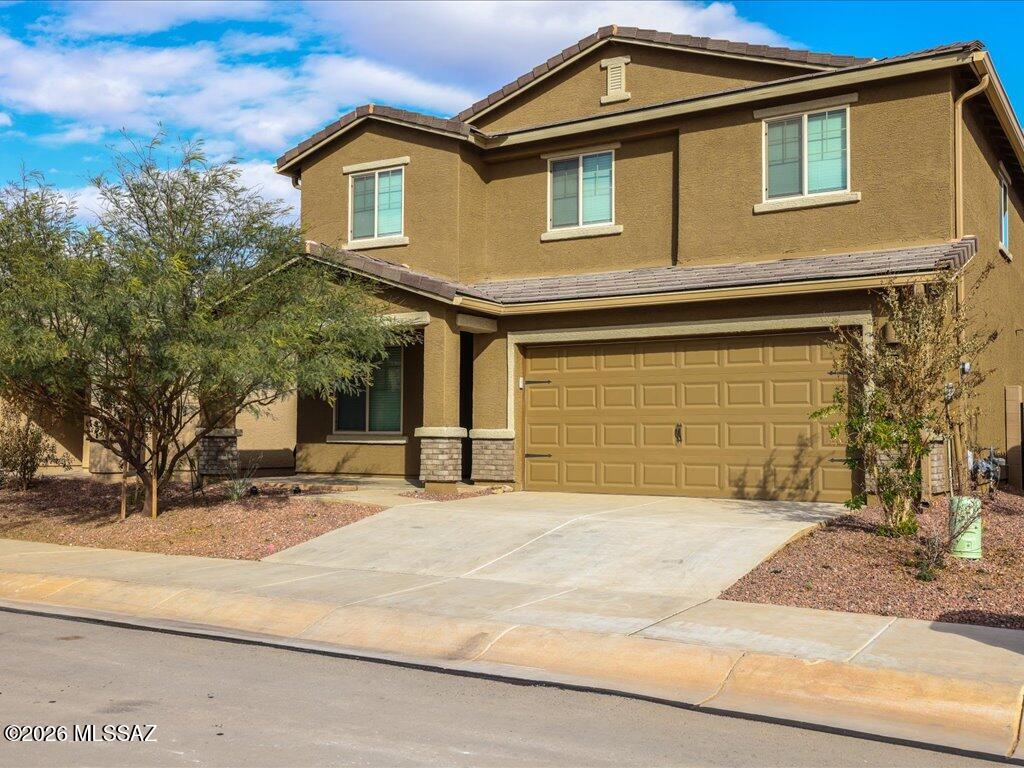 Welcome to this spacious and beautifully designed 5-bedroom, 3-bath home in the growing community of Red Rock Village! Built in 2023, this two-story residence offers thoughtfully designed living space featuring an open-concept floor plan, modern finishes, and abundant natural light throughout. The stylish kitchen boasts energy-efficient appliances, ample counter space, rich wood cabinetry, and a large island. Upstairs, enjoy generously sized bedrooms and a versatile loft area ideal for a home office, game room, or additional living space. The primary suite offers comfort and privacy with a spacious layout and ensuite bath. Additional highlights include central A/C, a 2-car garage, and a low-maintenance lot. Conveniently located near I-10 for easy commuting with a 2-car garage.