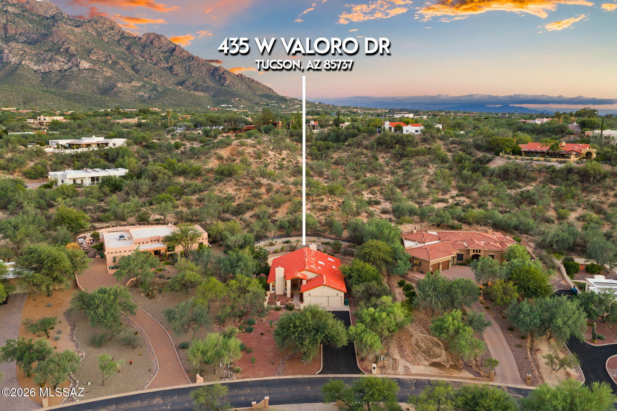 Sitting on a private 1.4-acre lot in Oro Valley Country Club's Valoro Estates, 435 W Valoro Drive offers an incredibly convenient location to enjoy all that Oro Valley has to offer. At your fingertips you will find golf, swimming, courts, hiking and biking trails. Unique to Valoro Estates, this parcel does not have an HOA. Featuring a classic Mediterranean style, the residence sits nicely back from the street. The 3-car garage is extended in height, providing excellent space and storage. Leading to the main entry, a fenced courtyard provides a welcoming arrival.  Inside the 2,556 sq ft home, there are 2 bedrooms, 2 bathrooms, a spacious den and 2 living spaces. The light and warm interior has been completely repainted to complement the travertine stone floors and warm wood cabinetry. Angled ceilings and abundant windows create a feeling of airiness with visual pathways to the greenery outside.

The backyard is a serene desert cocoon with wonderful plantings on tiered levels. The setting feels secluded and special. Southeast exposure provides the right amount of sun and shade to enjoy the pool and covered patio.

Outside of the backyard, a meandering trail leads to the hilltop for the most magnificent views of the Catalina Mountains, Pusch Ridge and the Sonoran Desert sunsets. A truly remarkable amenity and standout feature.

From 435 W Valoro Drive, it's easy to walk to the Oro Valley Country Club amenities, including the golf course, courts, dining and gym facilities. Cyclists have neighborhood access to The Loop paved trail system, avoiding busy roads completely. Within a few minutes, hiking is available at the Linda Vista trail or Catalina State Park, swimming is available at the Oro Valley Aquatic Center and there are multitude of options for shopping & dining.  Sitting at the south end of Oro Valley, this location provides much quicker access to amenities of the Catalina Foothills and City of Tucson.