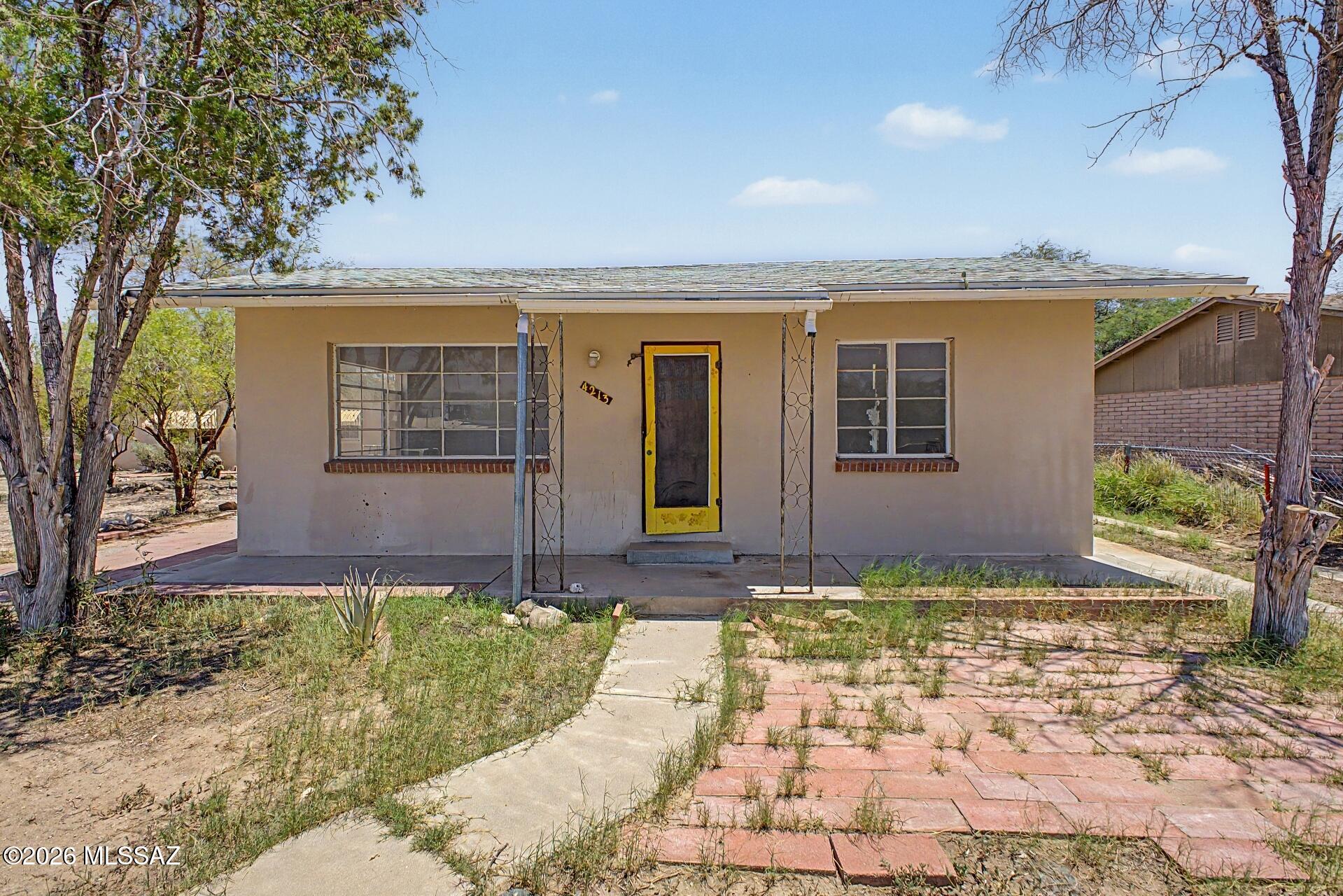 Home is being sold AS-IS. Exceptional opportunity in an established Tucson neighborhood! Situated on a spacious 13,900 sqft corner lot with NO HOA, this versatile property features a 1,431 sqft main home with 2 bedrooms and 2 baths, plus a detached 600 sqft guest house with 1 bedroom and 1 bath for a total of 3 bedrooms and 3 baths. A large living room, storage/workshop, and generous outdoor space add to the appeal. Ideal for multi-generational living, rental income, or hosting guests, this unique property offers flexibility, investment potential, and endless possibilities in a desirable location.