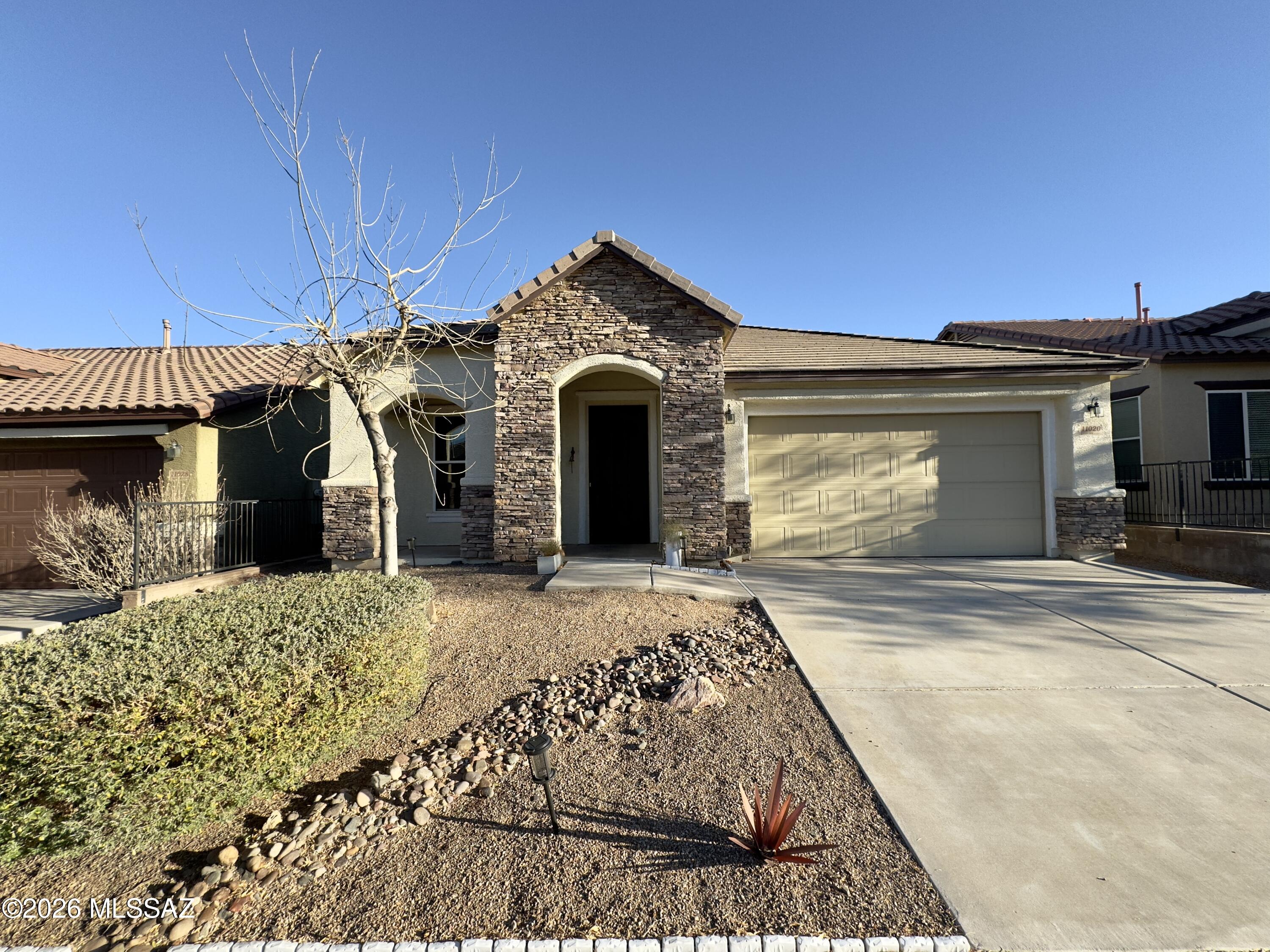 2,118 SQ FT! 4 bedroom, 2 bath home with a charming single-story floor plan in Vail. Home opens to a large living/dining room, great for entertaining! Kitchen boasts ample cabinetry, quartz countertops, an island with a breakfast bar, and included stainless steel appliances! Blinds and ceiling fans throughout! Lovely 4 bedroom home coming with tile and carpet flooring in all the right places. Primary bedroom offers an ensuite bathroom with dual sinks, separate shower/bath, and expansive walk-in closet. Laundry room with included washer/dryer. 2 car garage! Fully fenced backyard for relaxing outside, charming landscape in the backyard. Convenient Vail location, close to shopping, schools, and restaurants.