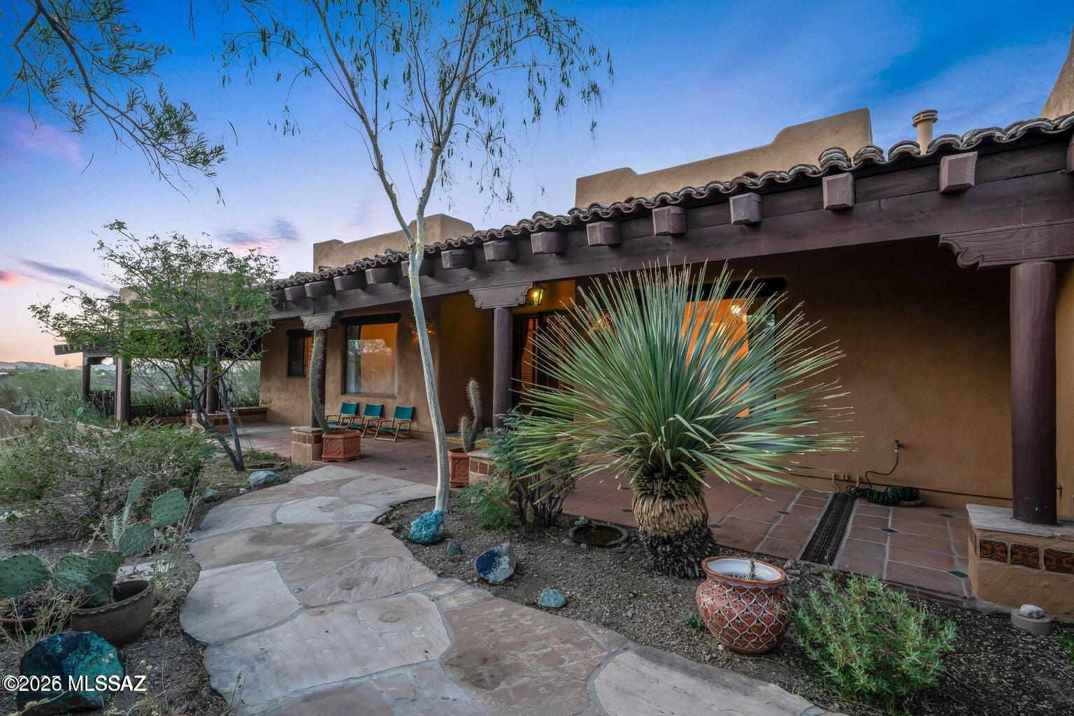 For Sale or For Lease!
Lease Purchase option!
This Santa Fe-style retreat on 3.3 private acres near Saguaro National Park. Surrounded by mountain views and natural beauty, this gated estate offers peace, privacy, and a true connection to the Southwest. Relax on the wrap-around porch, soak in the Pebble Tec spa, or unwind in the screened sitting room while listening to desert birds. Inside, warm wood, tile floors, and expansive windows frame breathtaking vistas. The gourmet kitchen is perfect for gathering, while the elegant primary suite with French doors, stained-glass accents, and spa-like bath creates a serene escape. With guest accommodations, office/den, and timeless Southwest charm, this home offers not just a place to live--but a lifestyle