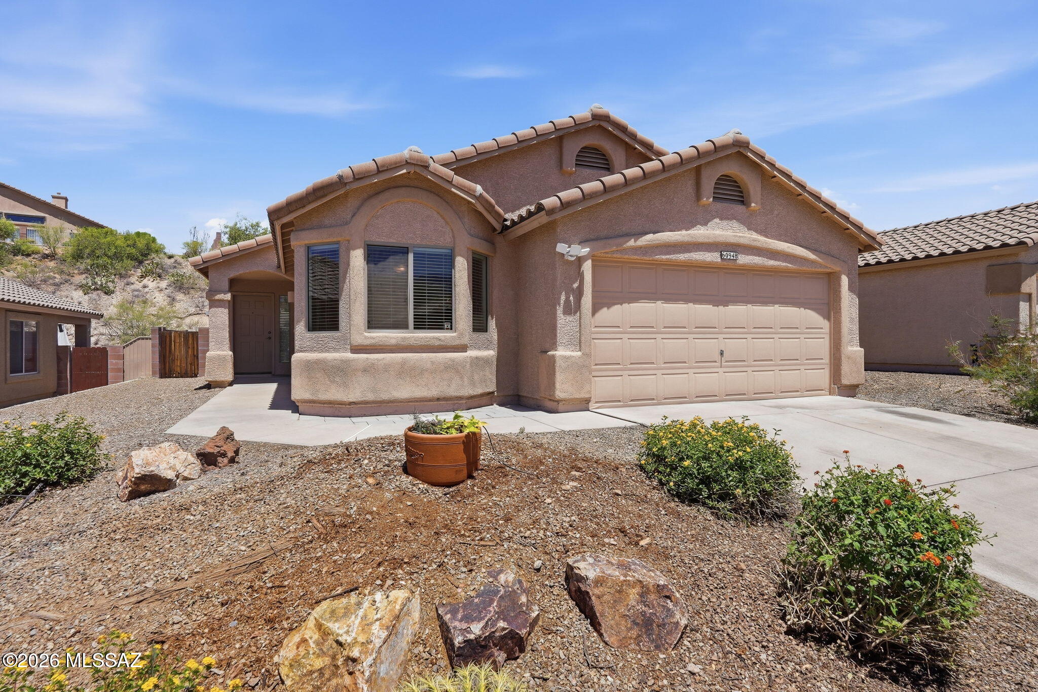 Tucked away on a quiet cul-de-sac in Eagle Crest Ranch, this charming 3-bedroom, 2-bath home offers comfort, functionality, and inviting indoor-outdoor living. The open floor plan features a spacious great room with vaulted ceilings and sliding glass doors leading to a covered patio, perfect for relaxing or entertaining. A versatile den provides the ideal space for a home office or study. The kitchen is equipped with stainless steel appliances, a breakfast bar, and dining area for easy everyday living. The split-bedroom layout offers added privacy, while the primary suite features abundant natural light, dual vanities, and a walk-in shower. Enjoy the low-maintenance backyard and covered patio, ideal for taking in Arizona's beautiful weather. This well-designed home is a must-see!