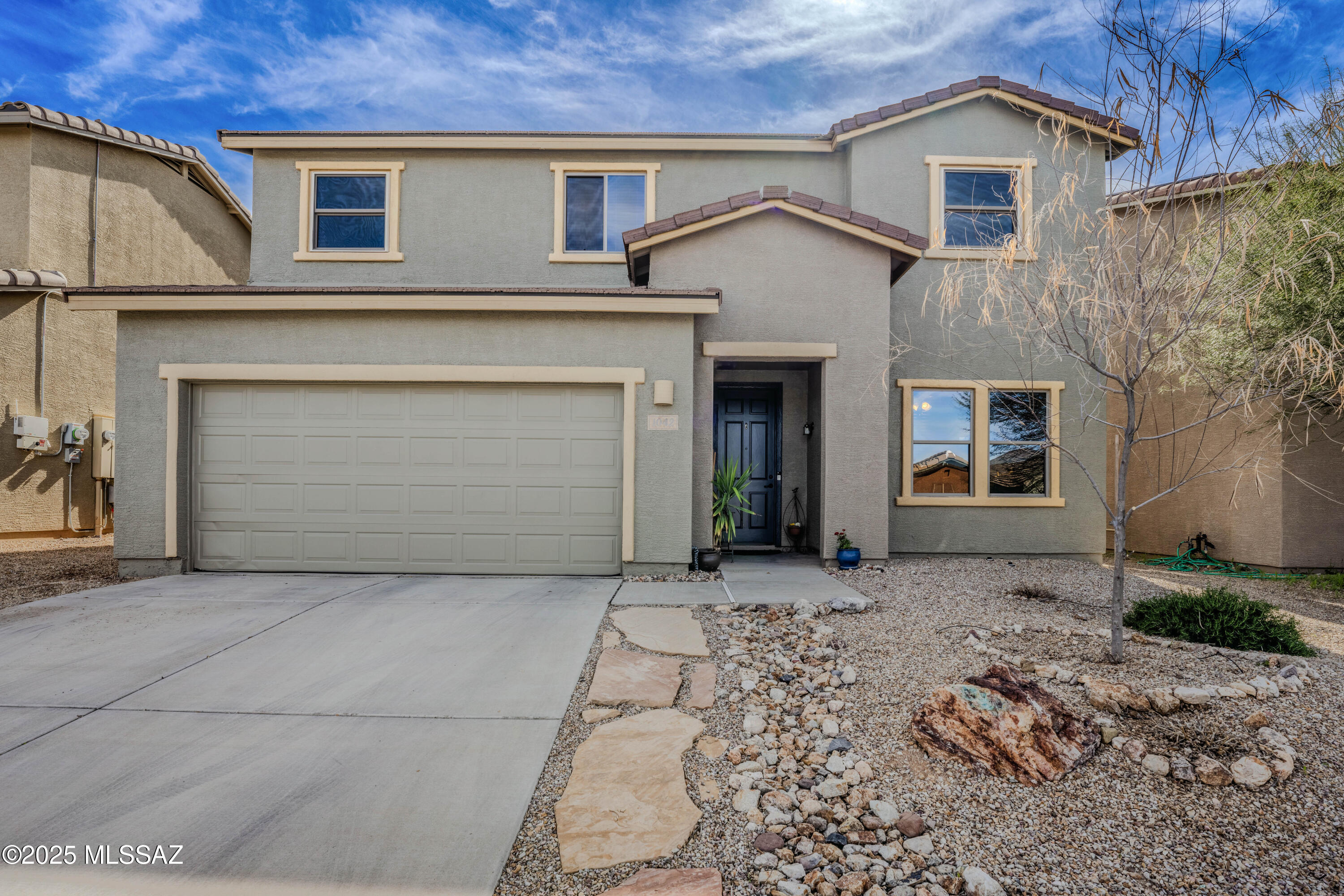 This solidly built early-2000s home offers a rare combination of durability, thoughtful upgrades, and a highly efficient floor plan that sets it apart from many newer builds that often come with early structural and maintenance concerns.

From the moment you enter, the home presents a desirable layout with no wasted space--no long hallways or unusable upstairs landings--creating a clean, functional flow throughout. The bedrooms are generously sized, offering comfortable private spaces for all occupants. A key design advantage is the smart vertical separation: the primary suite is positioned above the living room and garage, while the secondary bedrooms and staircase are located over the garage and downstairs den. This layout significantly reduces noise transfer into the main living areas, enhancing day-to-day livability.

The kitchen and interior finishes include upgraded granite countertops, complemented by multiple thoughtful improvements throughout the home. The primary suite features a built-in custom closet system by California Closets, adding both organization and upscale functionality.

Energy efficiency and comfort were clearly considered in the home's design. The back of the home faces due south, allowing for excellent natural sunlight in the downstairs living areas during the winter months while minimizing heat gain in the summer. Solar screens on all south-facing windows further enhance temperature control and help reduce cooling costs during peak Arizona heat.

Exterior maintenance has been proactively addressed. The home was repainted within the last five years using premium products from Dunn-Edwards Paints. All stucco surfaces were back-rolled for improved adhesion and durability, with the south-facing elevation receiving a double coat to help prevent premature fading and improve long-term heat resistance. As a result, the exterior is well protected and should not require repainting for many years.

Overall, this is a well-maintained, intelligently designed home that balances durability, comfort, and energy efficiency in a highly functional floor plan.