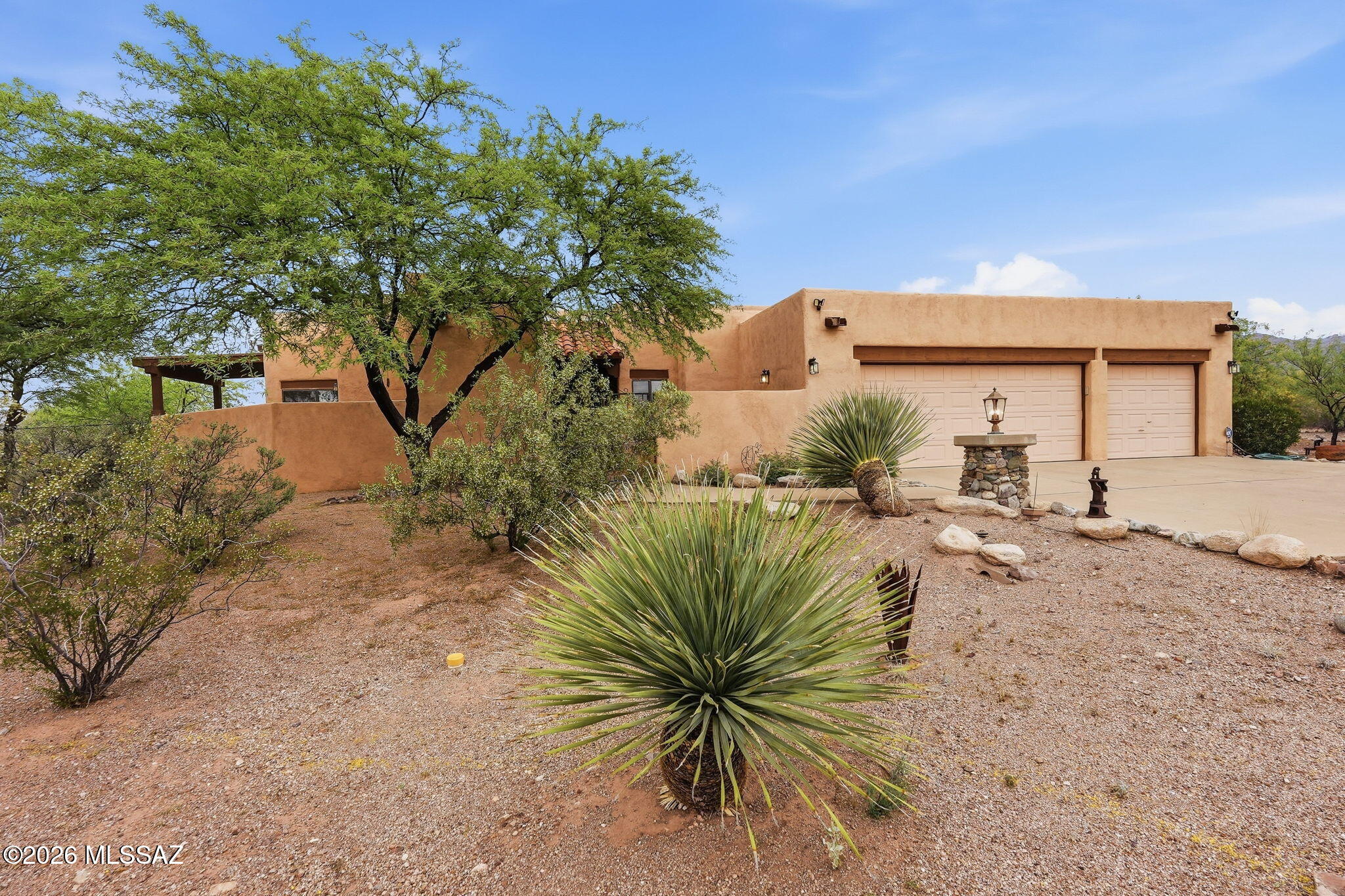 Escape to your own private sanctuary in the heart of Northeast Tucson's coveted Catalina Ranch Estates. Set on 3.19 serene acres, this 4-bedroom, 2.5-bathroom residence delivers an exceptional blend of refined living and resort-style outdoor entertaining.

Inside, soaring beamed ceilings and a dramatic clerestory bathe the living room in natural light, anchored by a warm fireplace perfect for desert evenings. The chef's kitchen impresses with chiseled granite countertops, a smooth cooktop, classic oak cabinetry, and a pass-through wet bar -- ideal for effortless entertaining.

Step outside to your personal oasis: a PebbleTec pool and spa, swim-up bar, fire pit, and a gas fireplace create an atmosphere that rivals the finest resorts. A three-car garage plus carport offers abundant stora while a windowed shed adds versatile flex space.

Located within the highly regarded Tanque Verde School District, with Agua Caliente Elementary and Tanque Verde High School -- both rated 9/10 -- just minutes away.

Space, privacy, and luxury, all without sacrificing convenience. This is Tucson living at its finest.