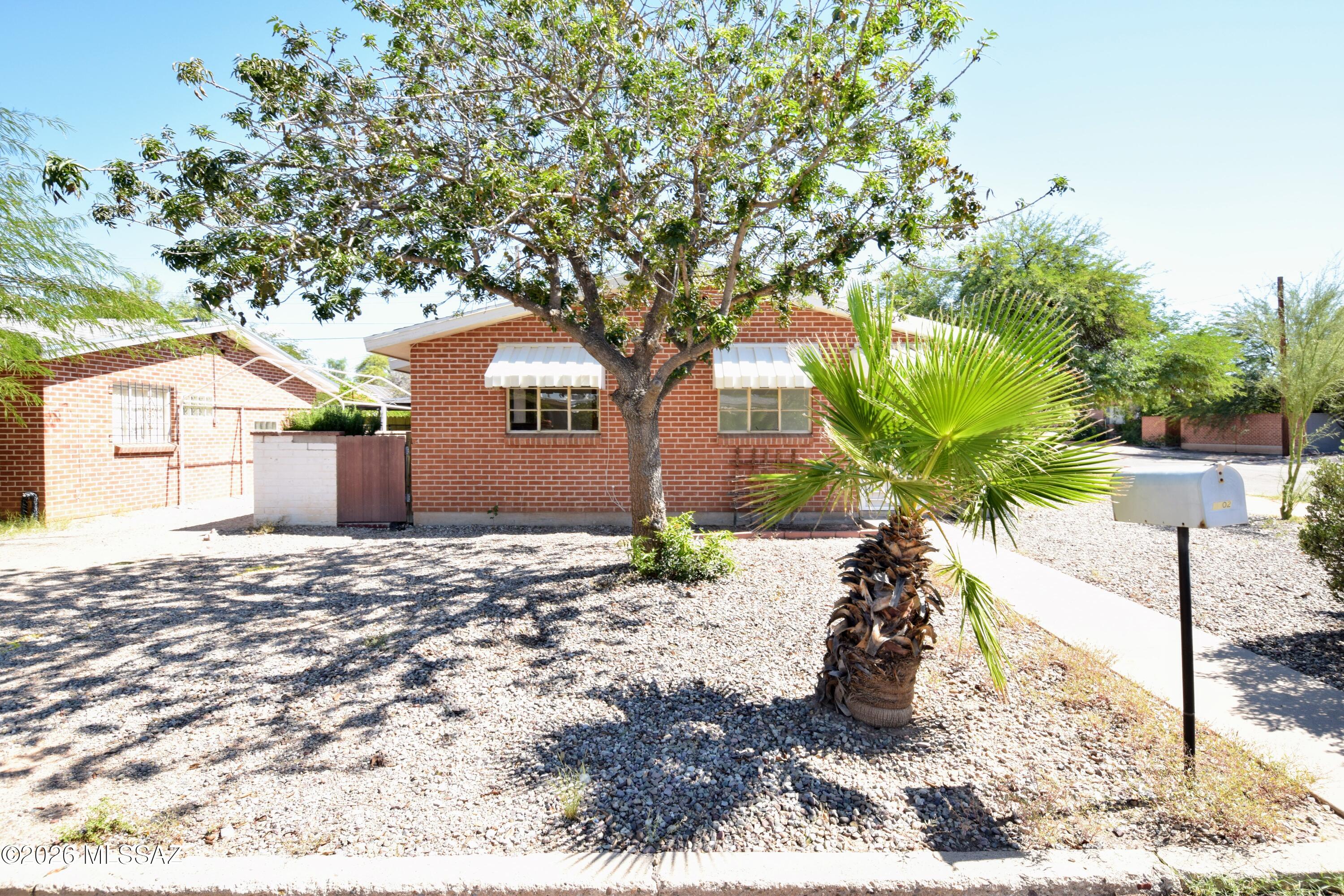 Welcome to this charming 650-square-foot, 1-bedroom, 1-bathroom duplex unit located in Midtown Tucson. Featuring classic red brick exterior architecture, this rental combines mid-century character with modern comfort, highlighted by vintage pastel tile in both the kitchen and bathroom alongside cooling ceiling fans in the living room and bedroom. Efficient mini-split units provide customized heating and air conditioning throughout the space year-round. Residents will appreciate convenient off-street parking and an included full-size washer and dryer located outside. Perfectly positioned in a vibrant midtown neighborhood near the University of Arizona, Banner University Medical Center, local parks, dining, and shopping, this property offers an ideal blend of convenience and historic charm. Pets are considered on a case-by-case basis. Whether you are seeking quick access to downtown Tucson or a peaceful retreat with retro character, this delightful duplex unit provides a unique and welcoming home.