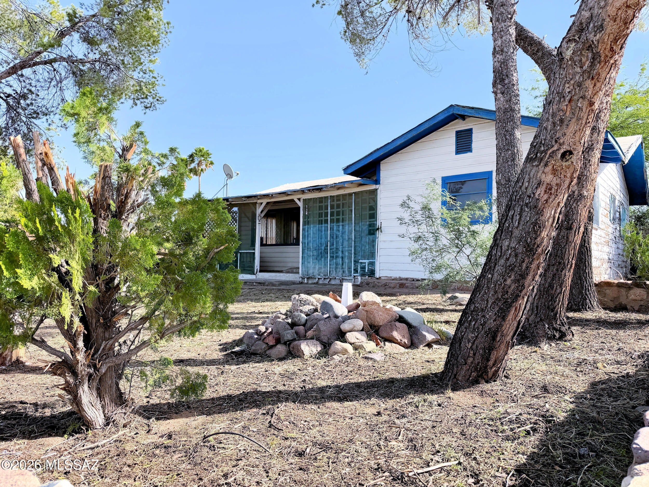 Restoration Project! Fix-Up Vintage Cottage in the Historic Town of Mammoth founded in 1872. This solidly built home is elevated above the street level allowing a vast view of the San Pedro River Valley & Mtns beyond from front porch & living rm! The Floorplan features a Living/Dining/Family space plus 3 BR & a bath. Fenced Yard & Enclosed rear patio w/utility closet. Mammoth offers paved streets, sidewalks, city water/sewer, elementary/middle schools, library, city pool & city parks. Convenience stores w/grocery, fuel station and daily amenities are available in the town. Enjoy Hiking & Off Road Touring in surrounding public lands. 30 min to the big stores & restaurants in Catalina, Starbucks, Safeway, Tractor Supply! 45 min to Oro Valley where you'll find endless shopping& services.