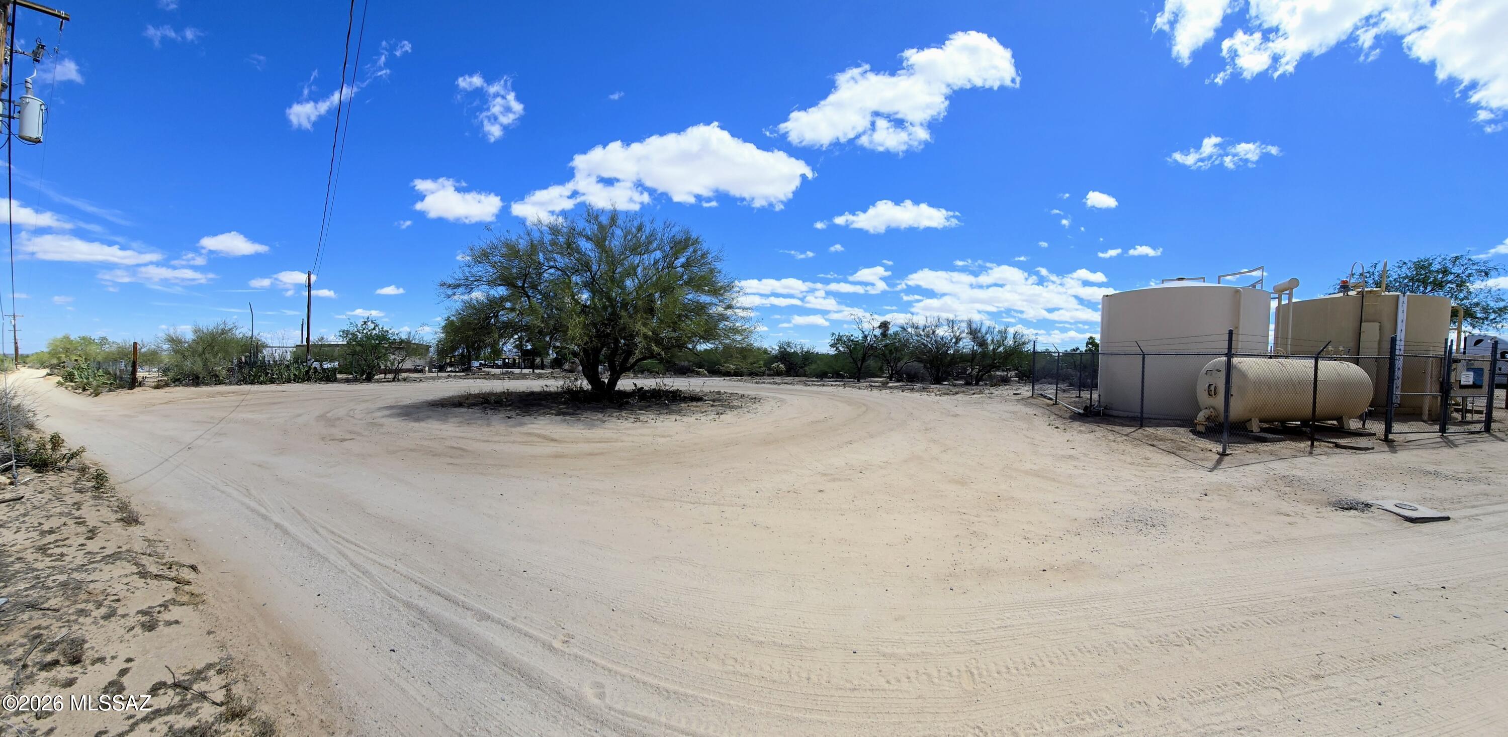 One acre with water, electric, telephone at the SW corner and a septic system. Utilities located at the SW corner across from the Sierrita Water Co-op wellsite which is located in the SW corner of this lot. A neighborhood market is nearby for essentials including gasoline.