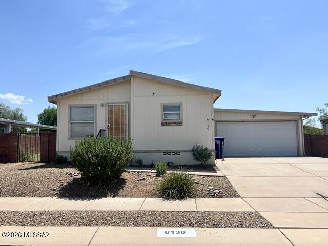 Cash Only - Investor or Handyman Special! Bring your vision and transform this spacious home into something special! Located in the desirable Window Rock gated community, this property offers an excellent opportunity to build instant equity with some TLC. The home features a functional split floor plan with a large living area, open kitchen with breakfast bar, indoor laundry room, and an oversized two-car garage. While it needs new flooring, fresh interior paint, and kitchen and bathroom updates, the layout provides a great foundation for renovation. Enjoy all the benefits of living in Window Rock, including a gated entrance, community clubhouse, and community park, all conveniently located just minutes from Davis-Monthan Air Force Base, I-10, shopping, dining, and medical facilities