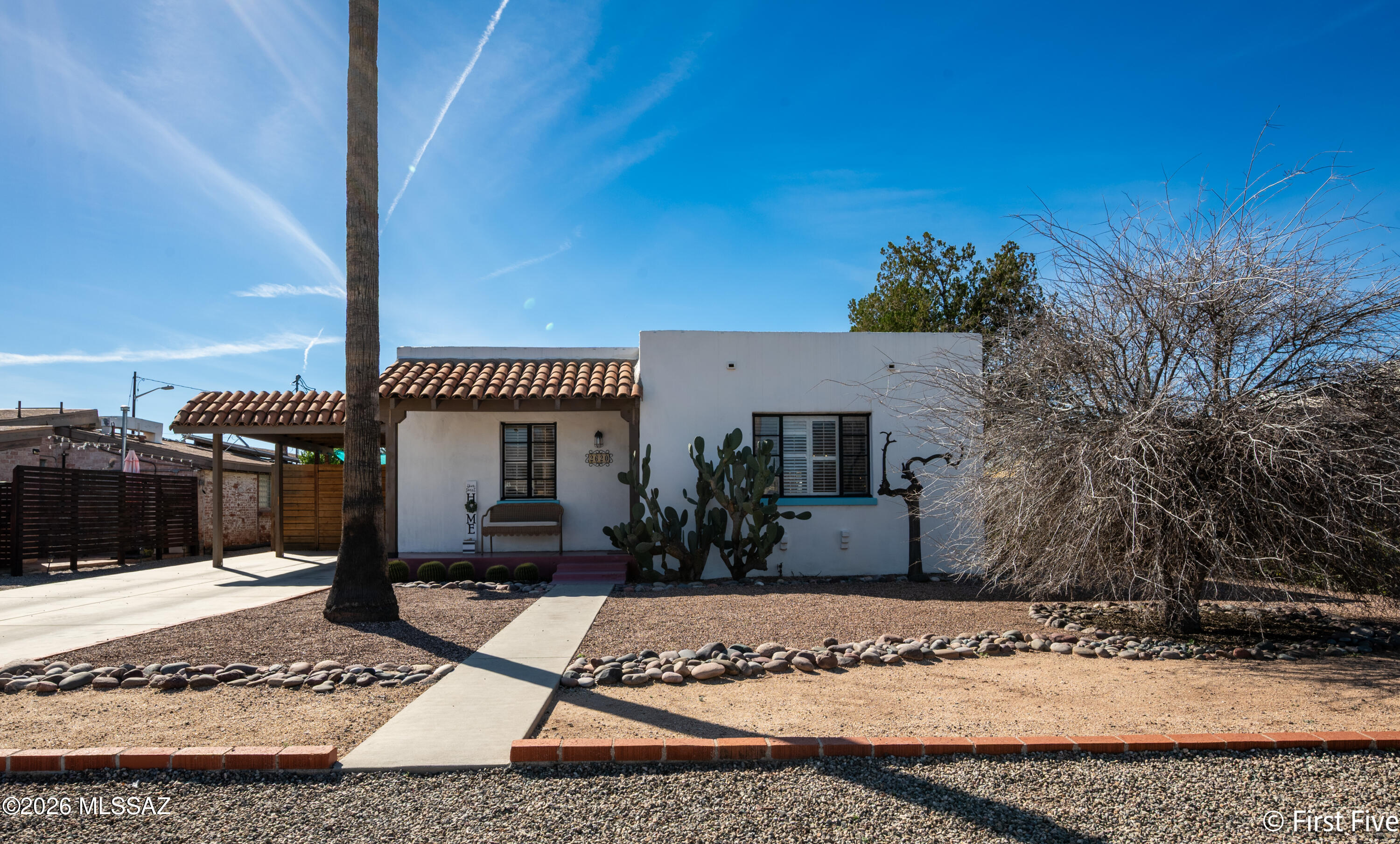 Charming fully furnished 2-bedroom, 1-bath home in the heart of the beloved Blenman Elm Historic Neighborhood. Overflowing with character, this 1,033 sq ft treasure blends thoughtful updates with authentic vintage charm. The inviting front porch, accented with artistic desert colors, pulls you into this mid-century modern stunner. Inside, you'll find beautiful hardwood floors, soft natural light, plantation shutters and eye-catching architectural details -- including white-washed exposed brick in the primary suite, masonry plaster walls, and graceful curved archways. The beautifully updated kitchen is a true showpiece, featuring open wood shelving, solid butcher block counters, subway tile backsplash, and the star of the show -- the original vintage oven that has been lovingly preserved. The adjacent dining nook offers charming designer lighting, and opens nicely to kitchen and living room, perfect for entertaining. Both bedrooms are peaceful retreats with hardwood floors and ample closet/storage space, while the stylishly remodeled bathroom showcases crisp white tile, with a modern grid-style shower enclosure, and patterned accents that nod to the home's historic roots. Step outside to the expansive .23-acre lot, where desert living thrives. Enjoy a spacious covered patio perfect for lounging or entertaining, mature trees, and inviting spaces for gatherings   including a fire pit area and tree-stump seating. The property also includes a whimsical chicken coop and run, ideal for urban homesteaders. This home places you moments from the University of Arizona, Banner Hospital, bike routes, parks, and all the charm of downtown Tucson. Equipped with everything you need - house wares, linens, full-size washer & dryer, and Wi-Fi. Close to fine dining and shopping, too. 1 month minimum Lease. List price is average, please call for exact pricing and availability!