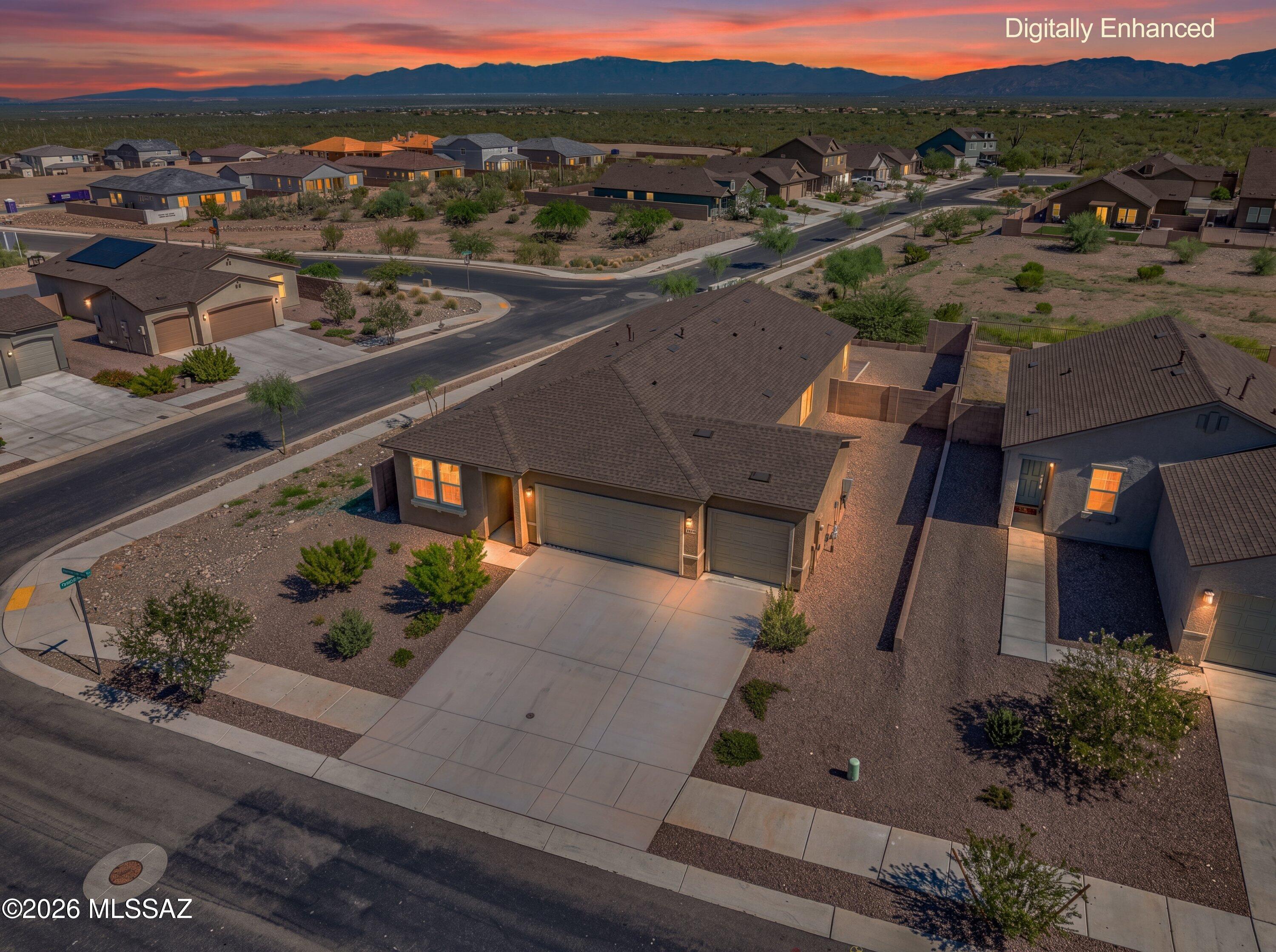 Welcome home to Sycamore Canyon in the award-winning Vail School District! Why wait on new construction when this move-in-ready home already has the space, finishes and backyard you're looking for? Situated on a desirable corner lot with no rear neighbors, this single-story, 4-bedroom, 2-bath home offers a 3-car garage and beautiful desert views right from your backyard.
Inside, you'll find a bright, open and airy floor plan filled with natural light. Tile flooring runs throughout the main living areas, with comfortable carpet in the bedrooms. The kitchen features granite countertops, stainless steel appliances and plenty of space to gather, while granite counters in the bathrooms add a polished touch throughout the home. Ceiling fans in every room help keep things comfortable year-round. Step outside to an already finished backyard, one less project to worry about! A large paver patio provides plenty of room for outdoor dining, entertaining or simply relaxing and taking in the peaceful desert views through the view fence.
This is your opportunity to skip the construction process and enjoy an established, move-in-ready home with a finished yard, premium corner lot and no neighbors directly behind you. Come see what makes this Sycamore Canyon home such a great place to call home!