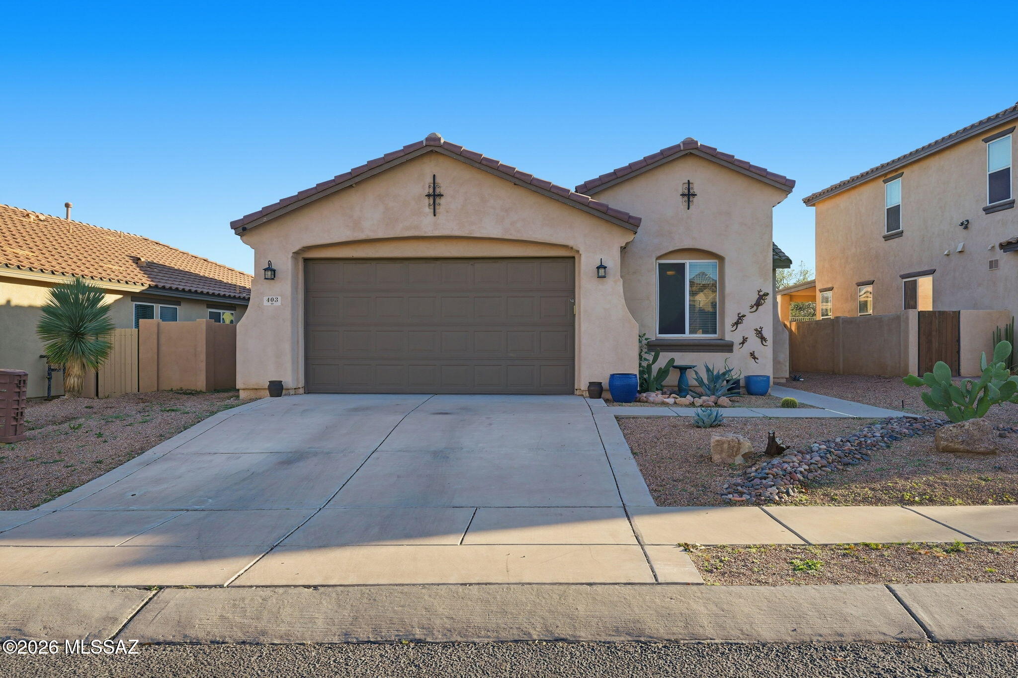 Assumable VA loan 4.1%! Discover refined desert living in this beautifully cared for; single story retreat, perfectly positioned with no rear neighbors, tranquil desert views & OWNED solar. Sunlit interiors, high ceilings, and a thoughtful split floor plan create an effortless sense of openness. The kitchen offers a walk-in pantry, sleek appliances, & an inviting breakfast nook, while the versatile den provides space to work or unwind. The serene primary suite features a double vanity, soaking tub, and generous walk-in closet. Outdoors, enjoy low-care landscaping, artificial turf, and a covered patio framed by view fencing, ideal for quiet mornings or glowing sunset gatherings. All within vibrant Rancho Sahuarita, where residents enjoy waterparks, lake, parks, athletic facilities & more!